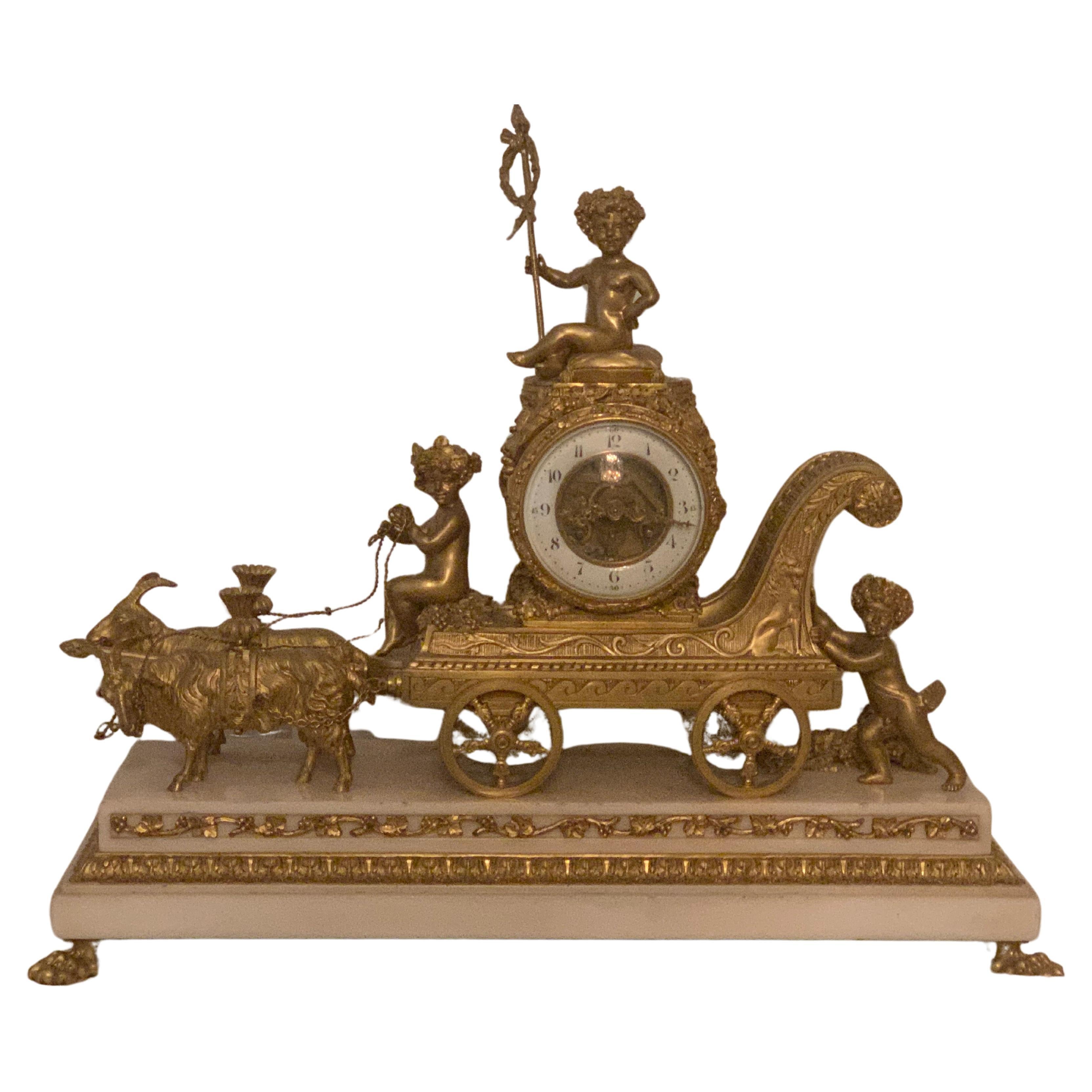 Magnificent 19th Century clock in bronze with cupids pulling a chariot by rams For Sale