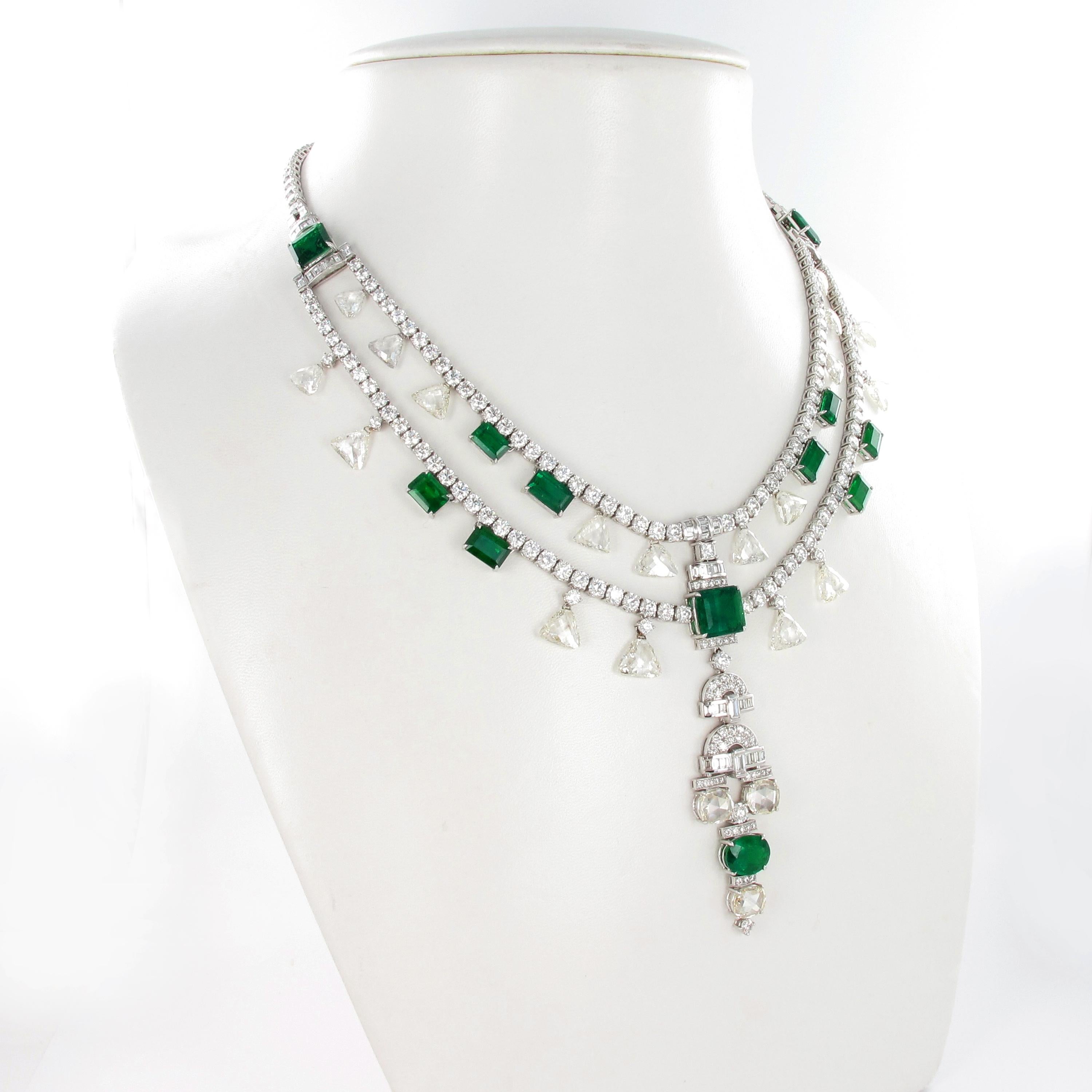 Set with thirteen oval and step-cut emeralds stated to weigh approximately 24.88 carats in total, embellished with 21 briolette-cut diamonds totalling approximate 29 carats. Finished with 336 diamond (brilliant- and baguette-cut) totalling