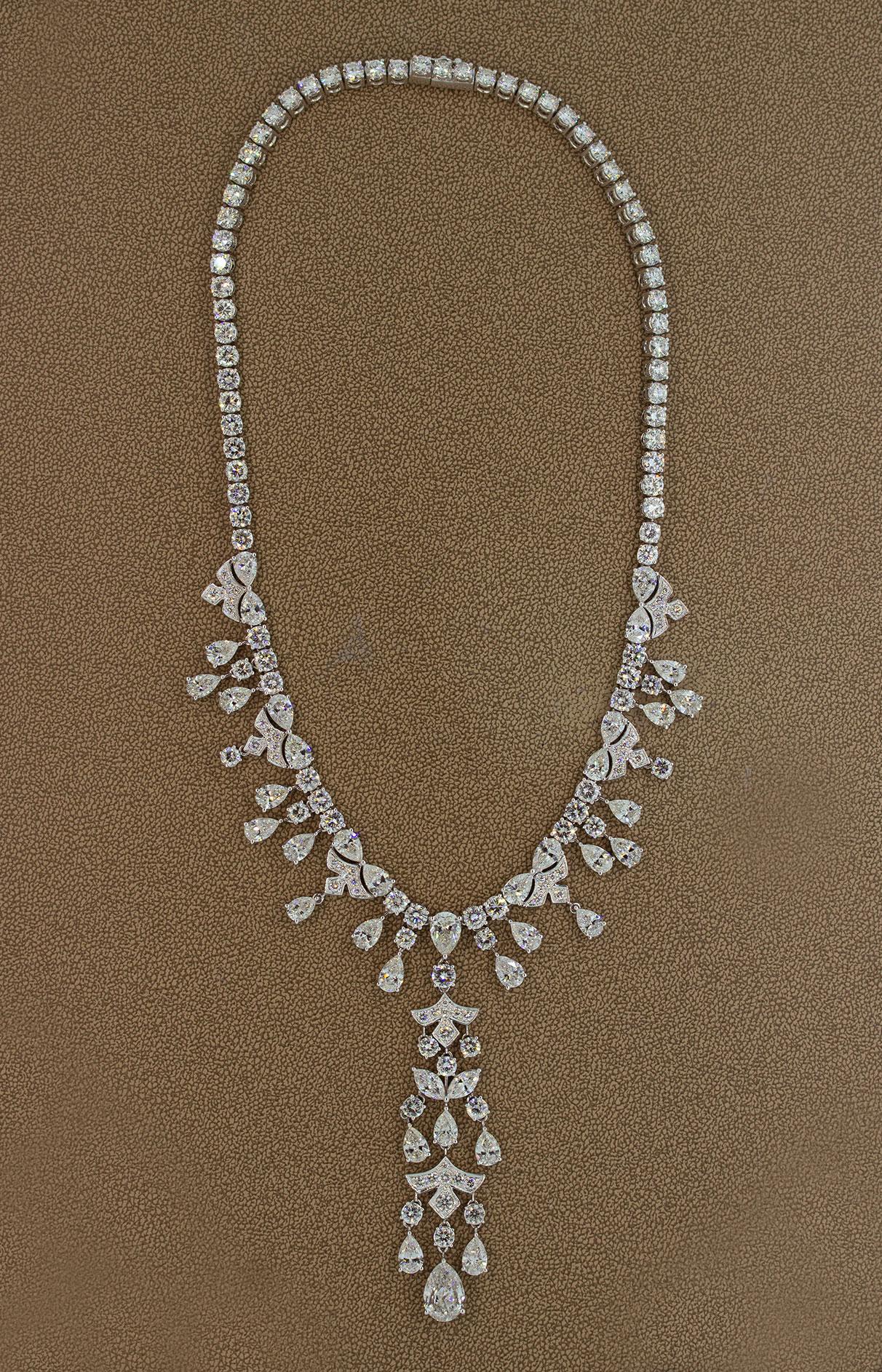The ultimate diamond evening wear necklace. Featuring a total of 59.44 carats of diamonds this necklace is ready to grace any ballroom outfit. The largest diamond on the necklace is the pear shaped diamond on the end of the drop which weights 2.77
