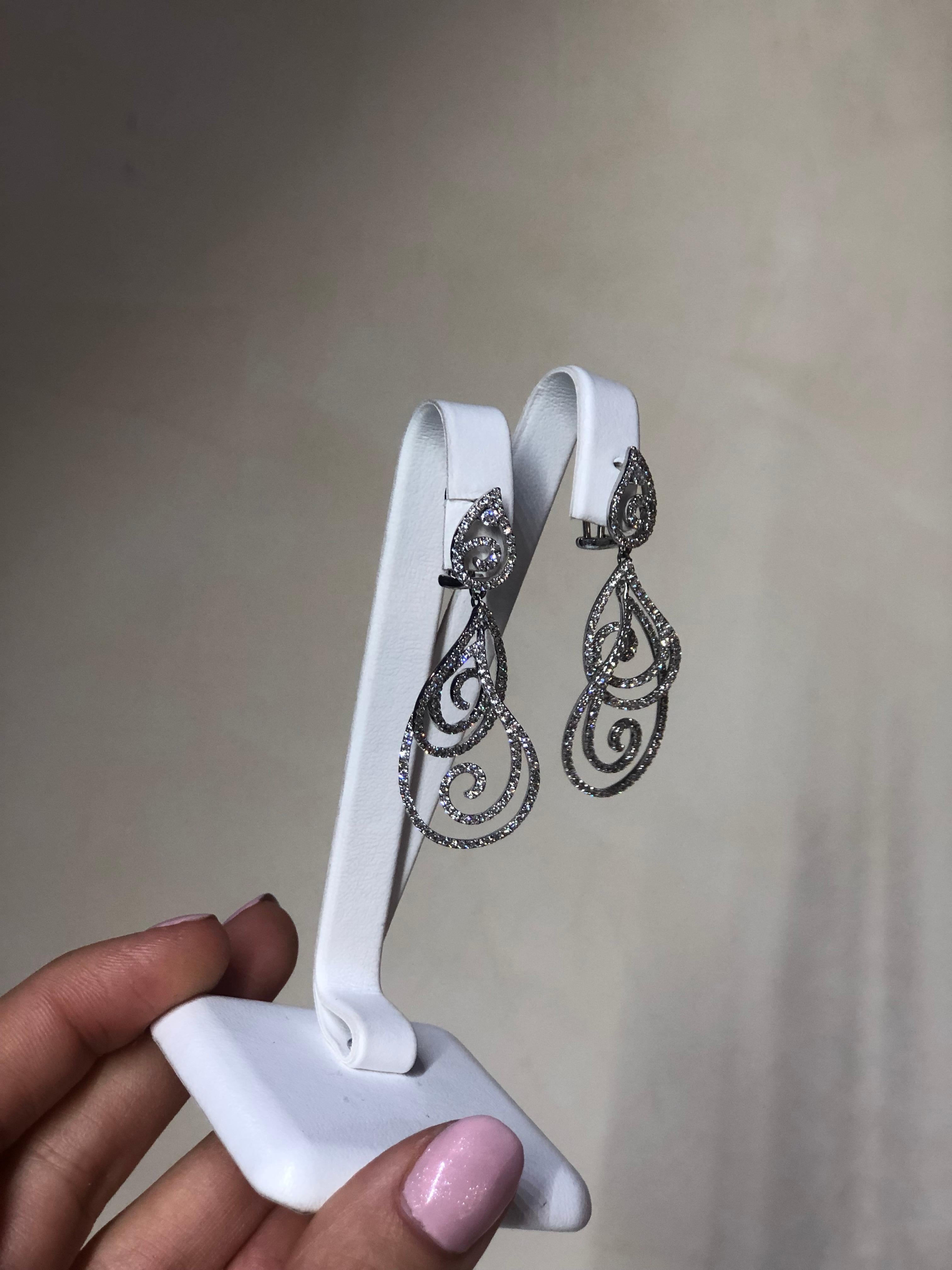 Earrings White Gold 14 K
Diamond 2-Round 57-0,12-3/6A 
Diamond Round 57-2,27-5/6A
Weight 9,72 grams

With a heritage of ancient fine Swiss jewelry traditions, NATKINA is a Geneva based jewellery brand, which creates modern jewellery masterpieces