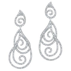 Magnifiques boucles d'oreilles en goutte en or blanc avec diamants de haute joaillerie