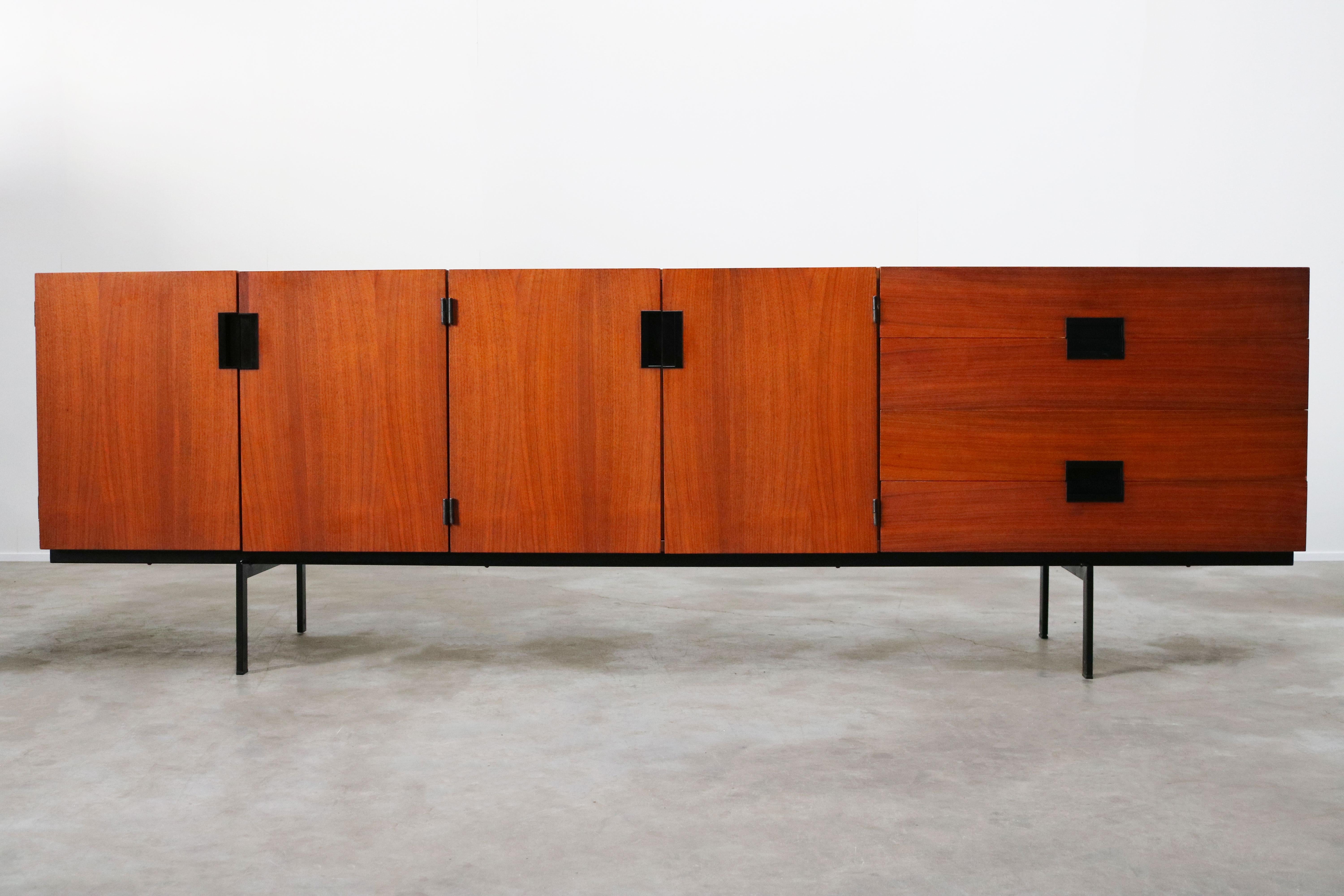 Magnificent fully original Dutch design sideboard or credenza Model: DU-03 by Cees Braakman for Pastoe 1954. The world famous design from Cees Braakman his DU03 sideboard. Its clean and modern design in combination with its warm teak and black metal