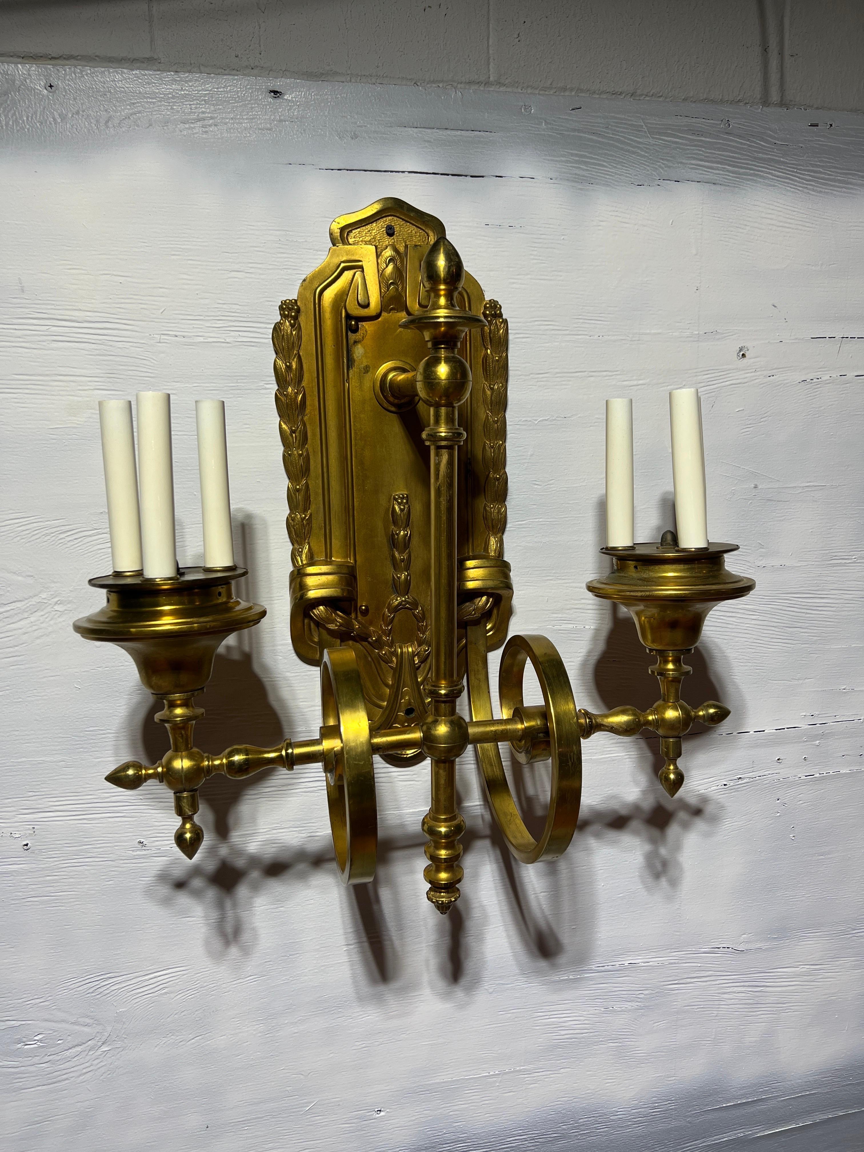 Magnificent E. F. Caldwell & Co Gilt Bronze Two Arm 6-Light Wall Sconce.

E. F. Caldwell & Co. was a prominent American lighting and metalwork company that operated during the late 19th and early 20th centuries. Known for their exquisite
