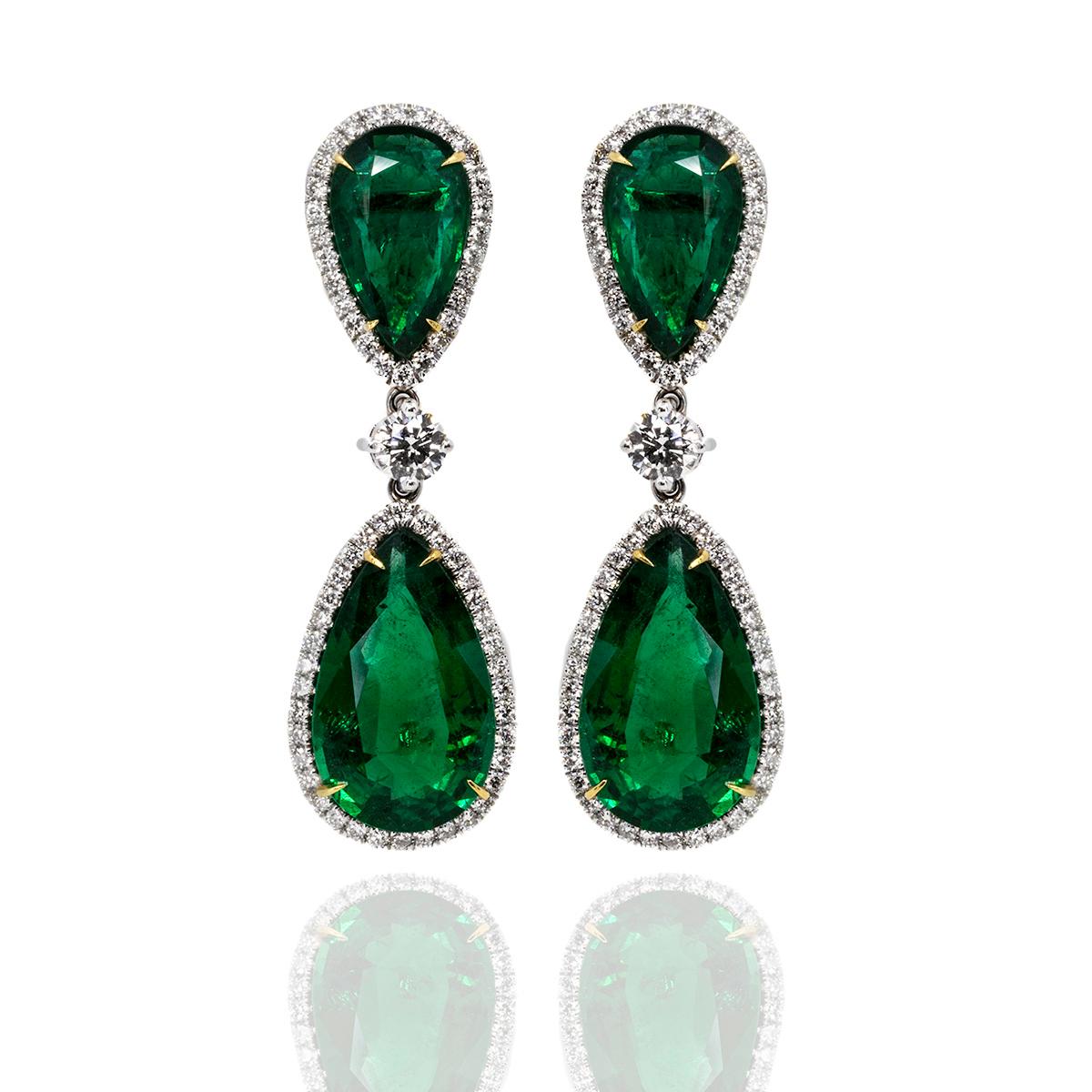 18k White gold earrings with 4 top gem quality pear shape GIA certified emeralds weighing 31.55 carats and 2.83 carats of collection color/clarity round brilliant diamonds.