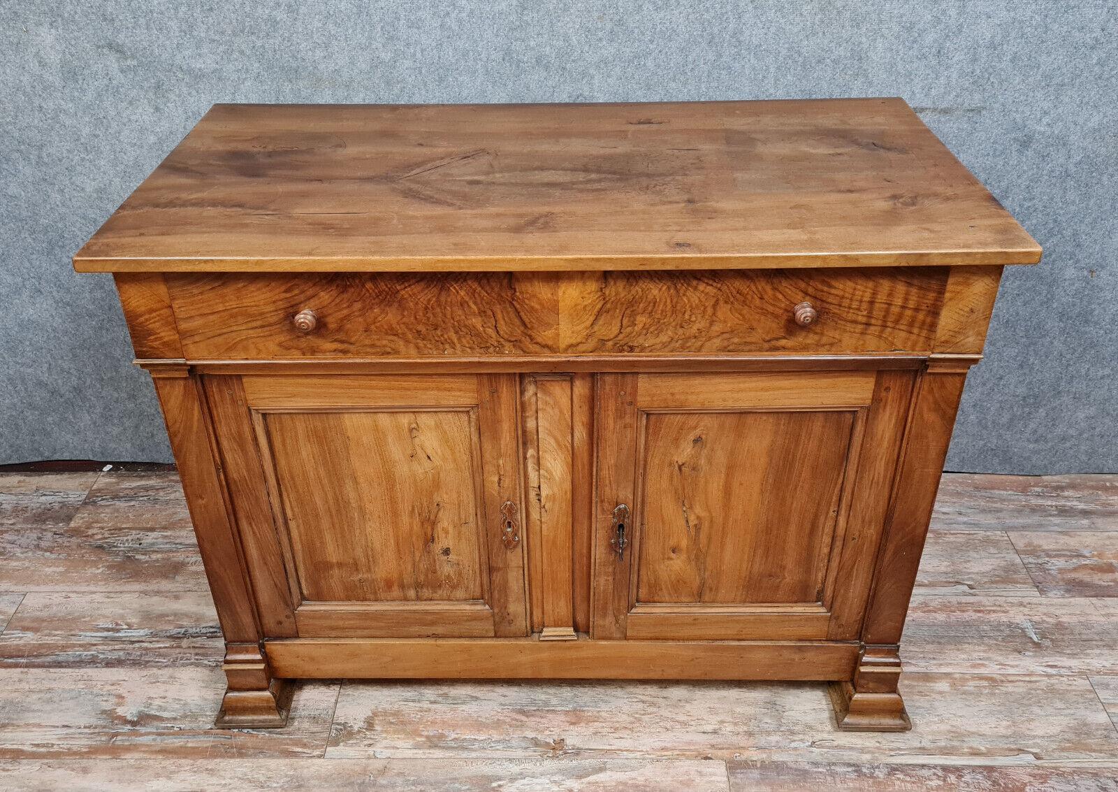 Transport yourself to the early 19th century with this magnificent Empire period walnut buffet, crafted around 1810-1820. A stunning example of the Empire style, this buffet exudes timeless sophistication and refined elegance.

Key
