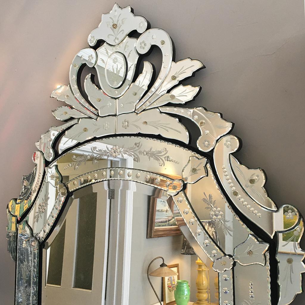Beautiful floor-length Venetian reverse etched glass mirror with floral decorations. This piece will make an instant impact in any room.