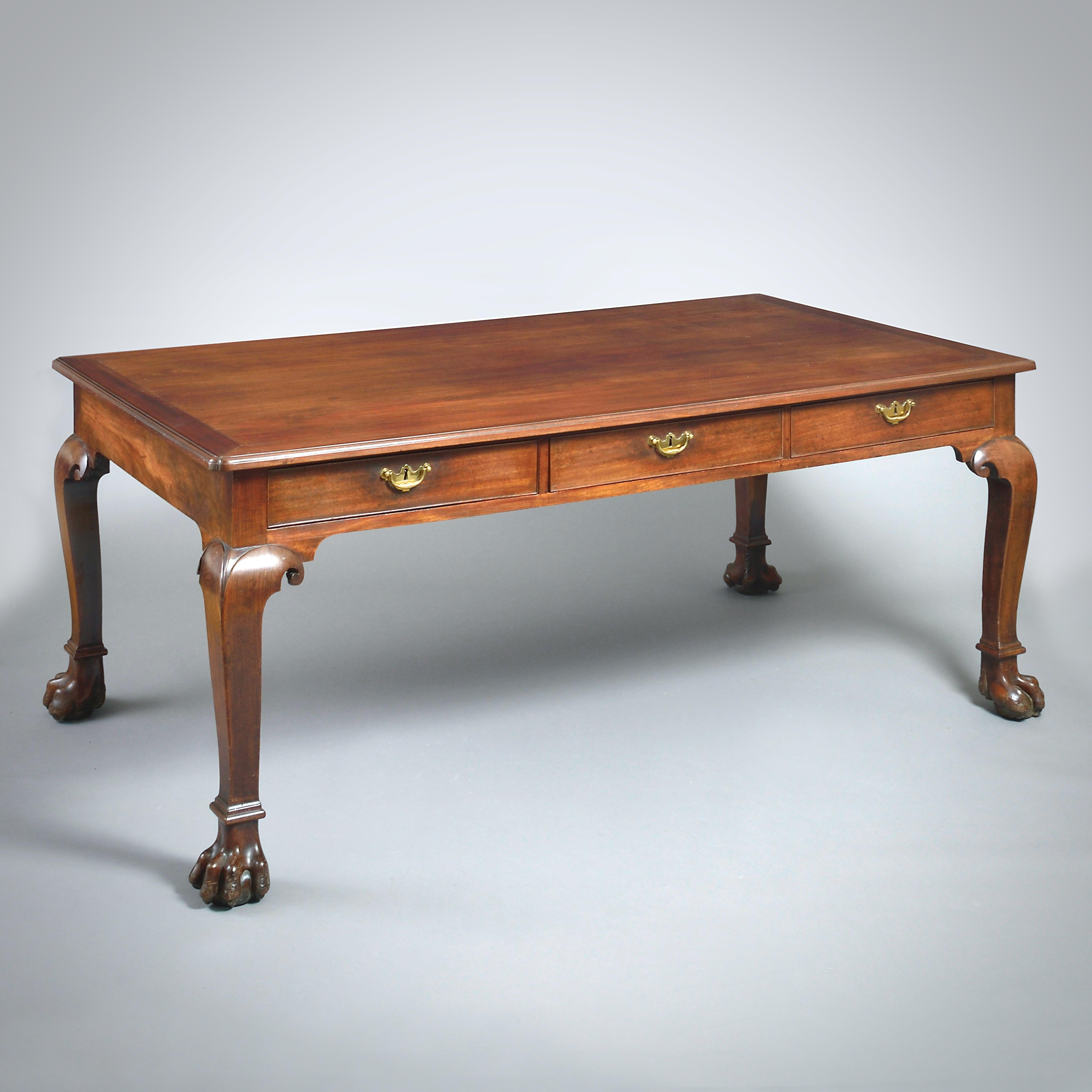 A MAGNIFICENT GEORGE II MAHOGANY LIBRARY TABLE, CIRCA 1740

The frieze with three oak-lined drawers to each side. Original locks and handles. The handles and back-plates retain their original gilt lacquering.

Provenance:
The Earls of