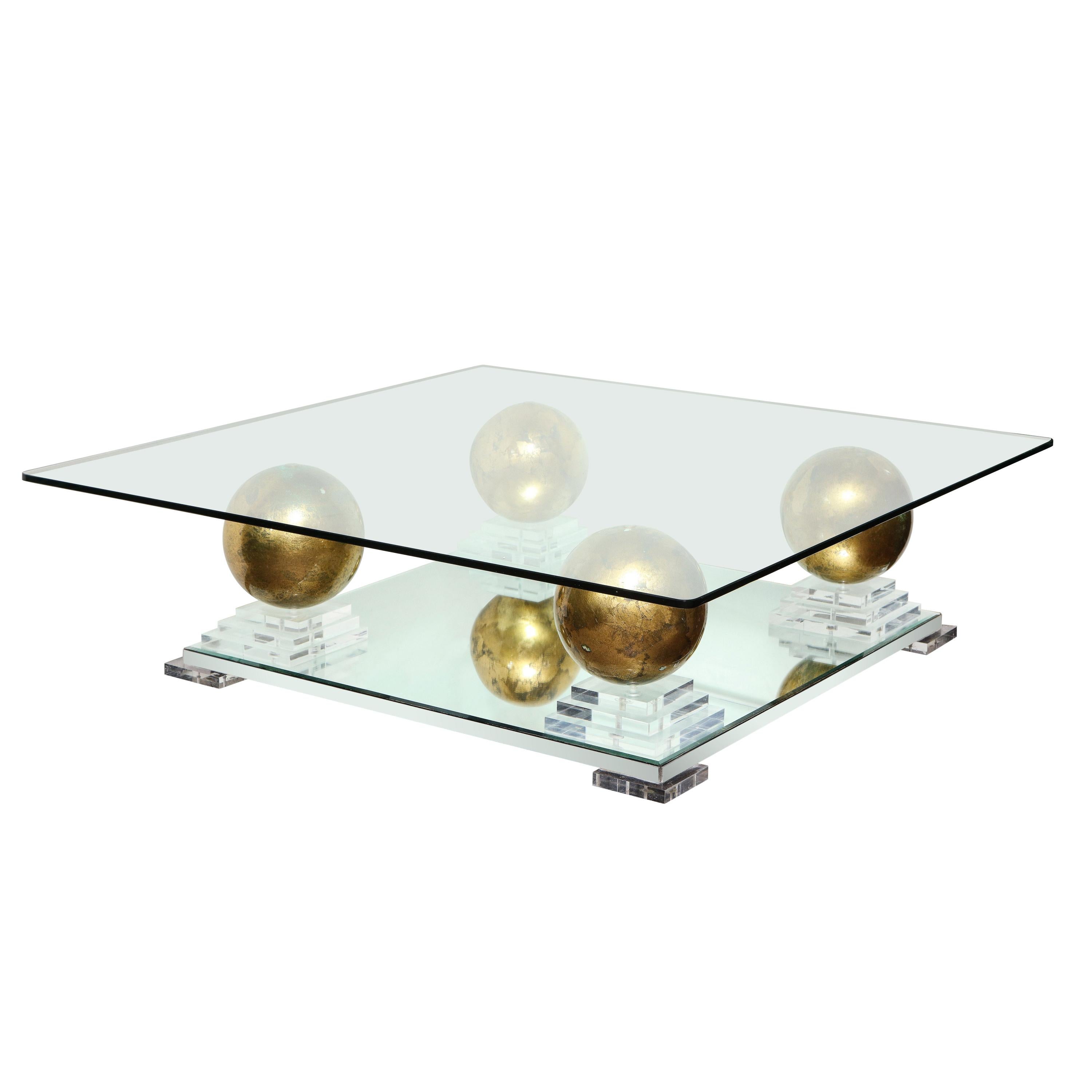 Magnificent glass coffee table with mirror & Lucite base and large gold gilded sphere motif. French, 1970's.