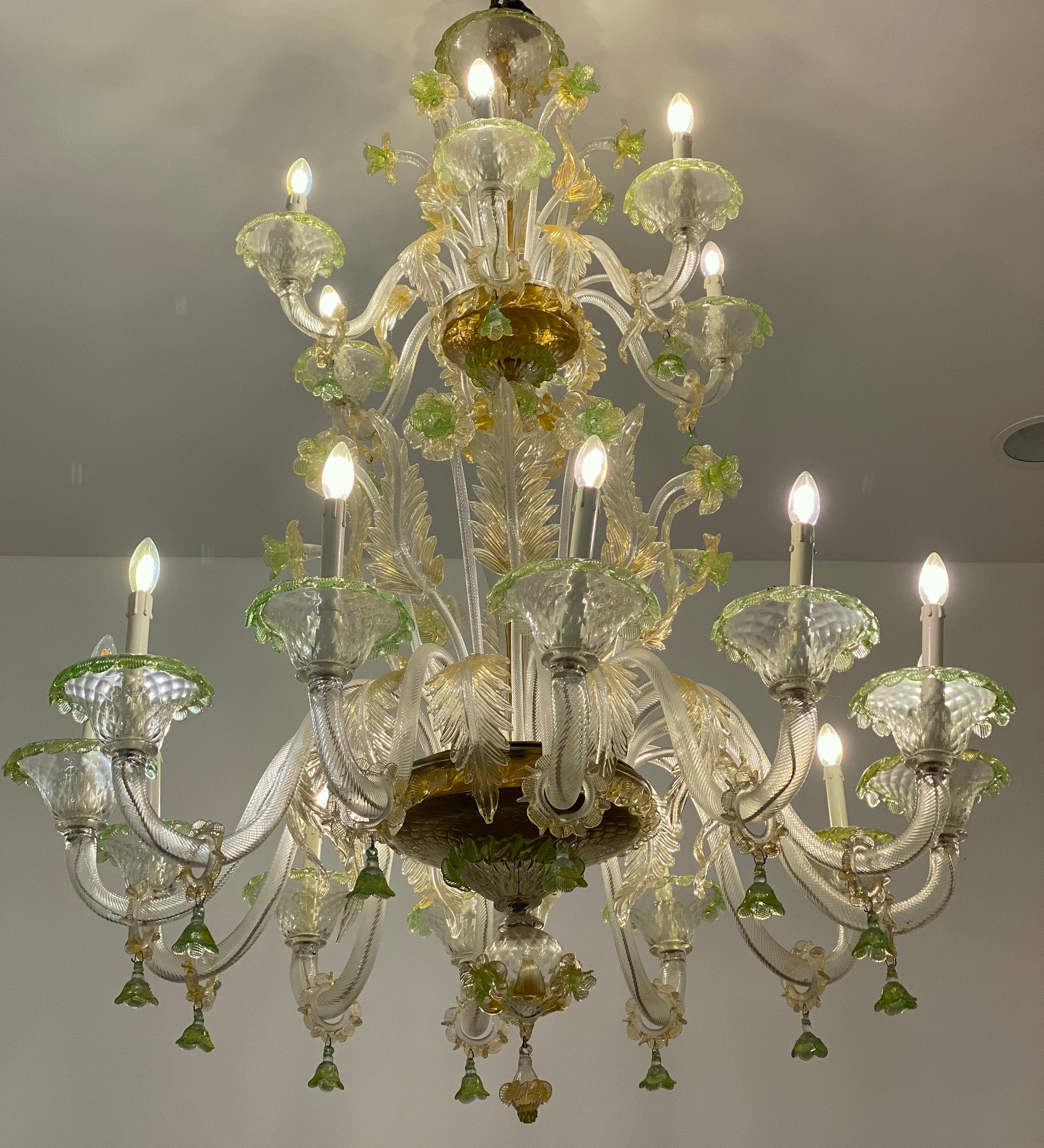 Spectacular Green flower shaped Murano chandelier . The arms 18 are arranged on two levels. The glasses are embellished with gold inclusions in perfect condition. These delicate colors create a unique warm atmosphere when the lights are switched