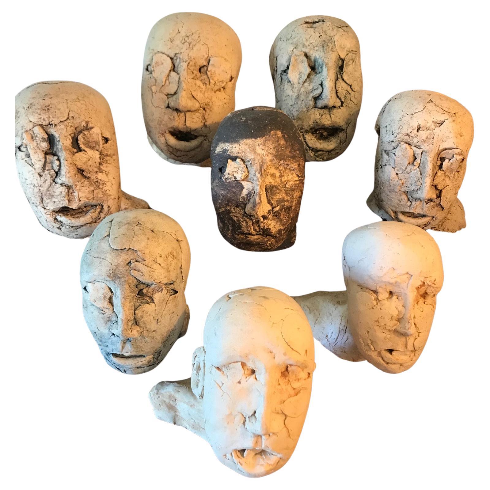 Magnificent group of 8 brutalist hand crafted clay heads. Belgium 1960's For Sale