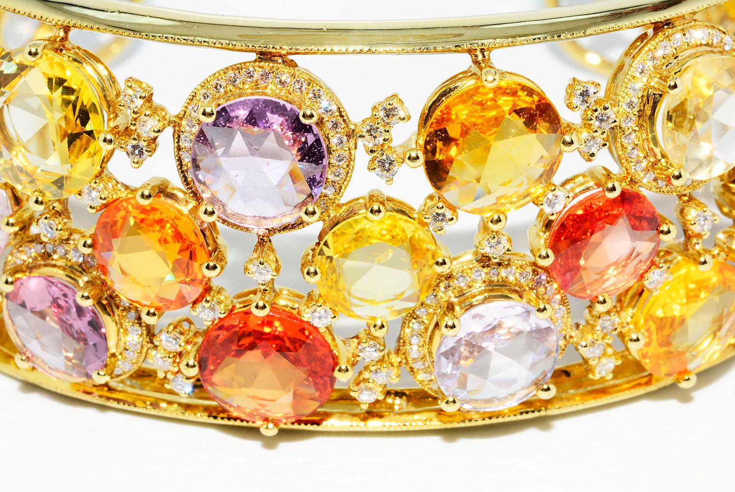 Magnificent Heat Only Multi color Sapphire and Diamond Bangle 18k Yellow Gold

Heat Only Multi Color Rose Cut Sapphires 74.64 ct
Round Diamonds 3.76 ct G VS2
18k Yellow Gold 75.73 Grams
Fits Wrist Sizes 7-8 Inches Length
