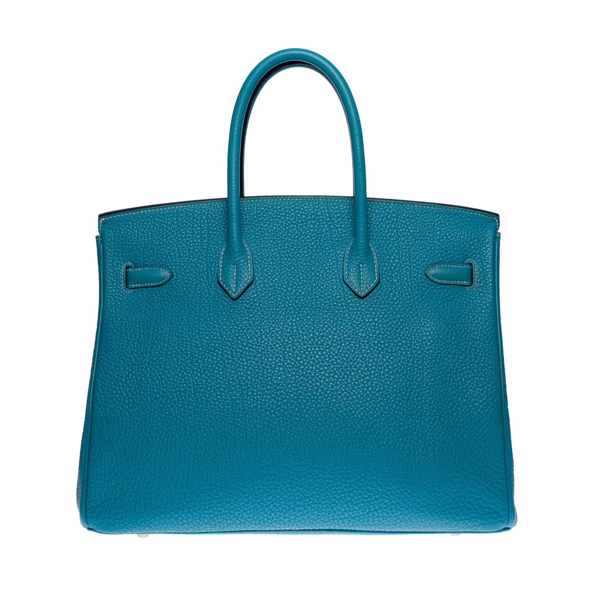 Exquisite Hermes Birkin Handbag 35 cm in Togo blue Saint-Cyr leather with white stitching, gold plated metal hardware, double blue leather handle allowing a hand-carried
Flap closure
Blue leather lining, one zippered pocket, one patch