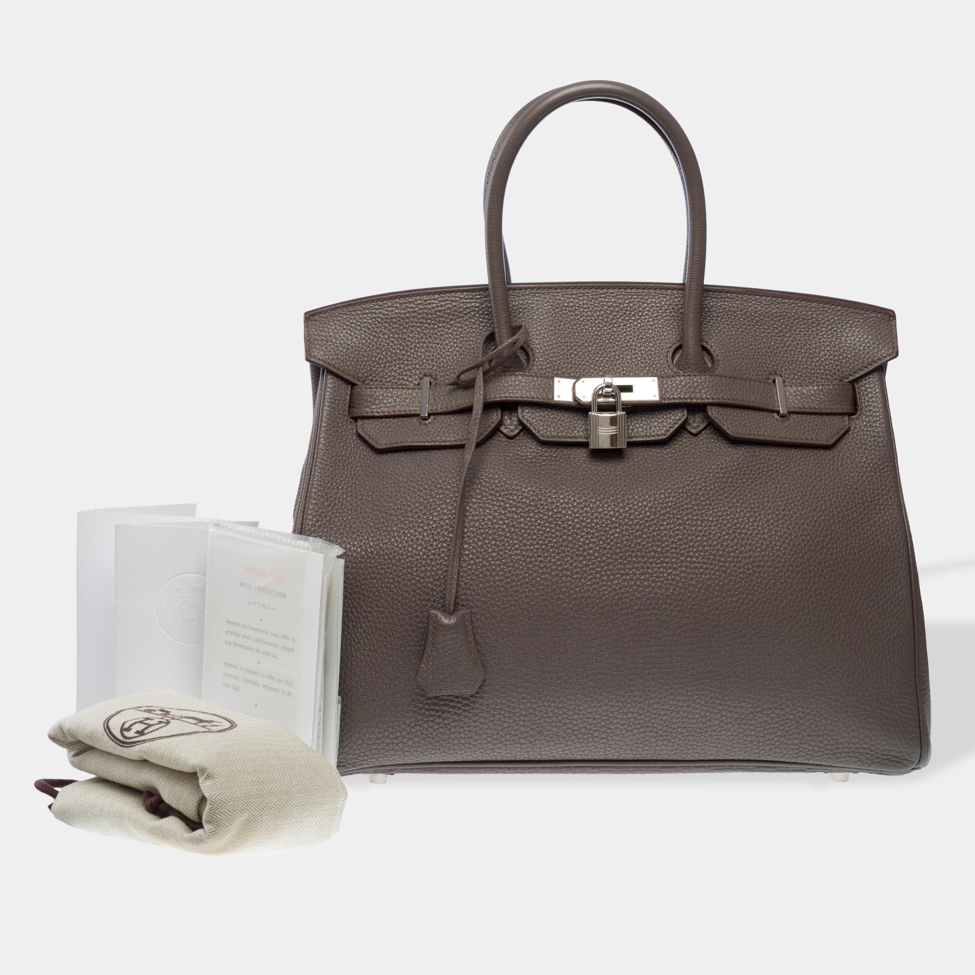 Magnificent​ ​Hermes​ ​Birkin​ ​35​ ​in​ ​Etain​ ​Togo​ ​calf​ ​leather,​ ​palladium​ ​silver​ ​trim,​ ​double​ ​gray​ ​leather​ ​handle​ ​for​ ​hand​ ​carrying

Flap​ ​closure
Gray​ ​leather​ ​lining,​ ​one​ ​zipped​ ​pocket,​ ​one​ ​patch​