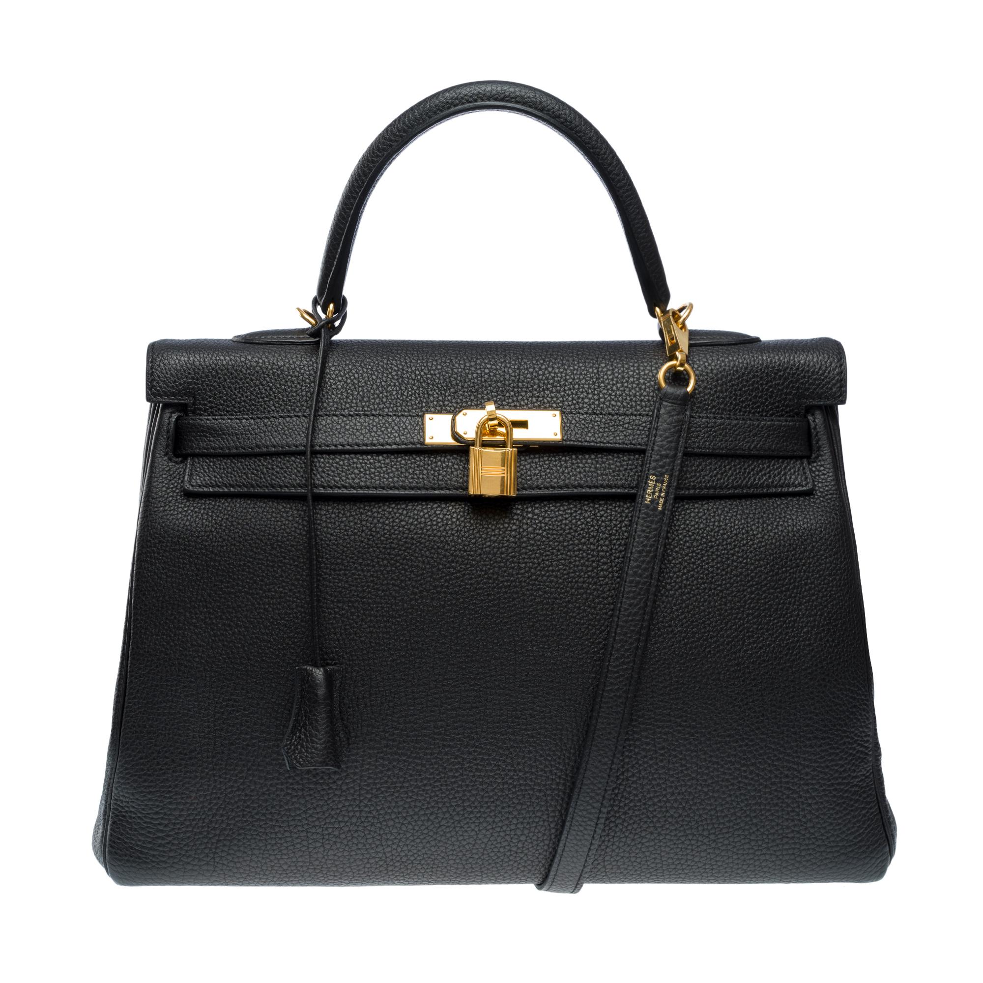 Magnificent​​​ ​​​Hermes​​​ ​​​Kelly​​​ ​​​35​​​ ​​​retourne​​​ ​​​handbag​​​ ​​​strap​​​ ​​​in​​​ ​​​Black​​​ ​​​Togo​​​ ​​​leather​​​ ​​​,​​​ ​​​gold-plated​ ​metal​ ​trim,​​​ ​​​black​​ ​​​leather​​​ ​​​handle,​​​ ​​​removable​​​ ​​​shoulder​​​