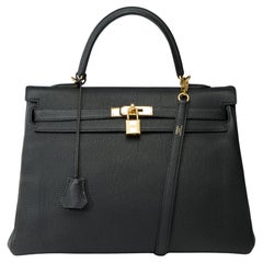 Magnificent Hermès Kelly 35 retourne handbag strap in Black Togo leather , GHW