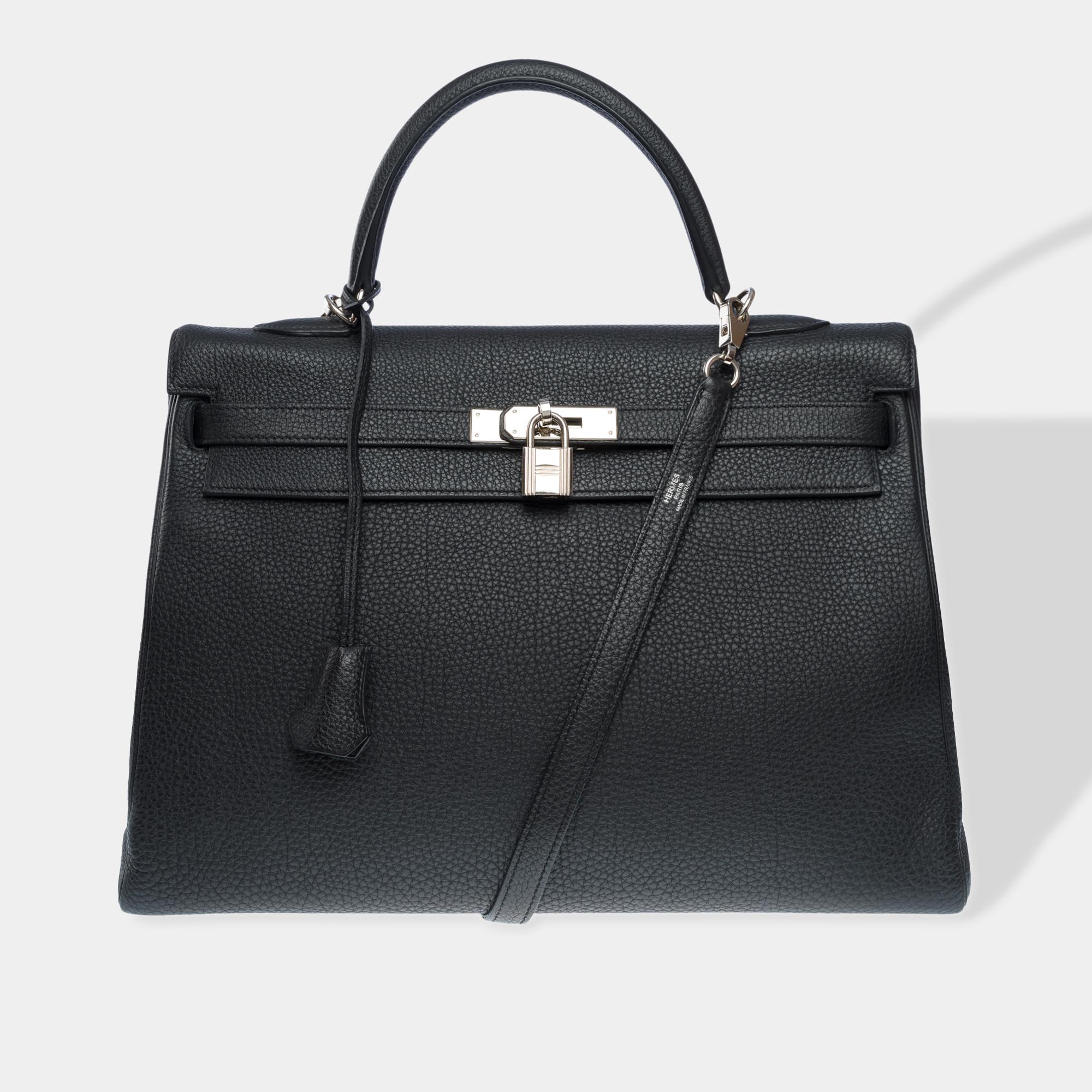 Magnificent​​ ​​Hermes​​ ​​Kelly​​ ​​35​​ ​​retourne​​ ​​handbag​​ ​​strap​​ ​​in​​ ​​Black​​ ​​Togo​​ ​​leather​​ ​​,​​ ​​palladium​​ ​​silver​​ ​​metal​​ ​​trim,​​ ​​black​ ​​leather​​ ​​handle,​​ ​​removable​​ ​​shoulder​​ ​​strap​​ ​​in​​