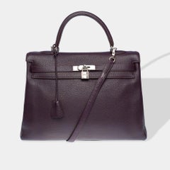 Magnificent Hermès Kelly 35 retourne handbag strap in Raisin Togo leather , SHW