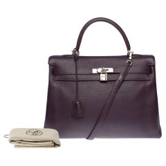 Magnificent Hermès Kelly 35 retourne handbag strap in Raisin Togo leather , SHW