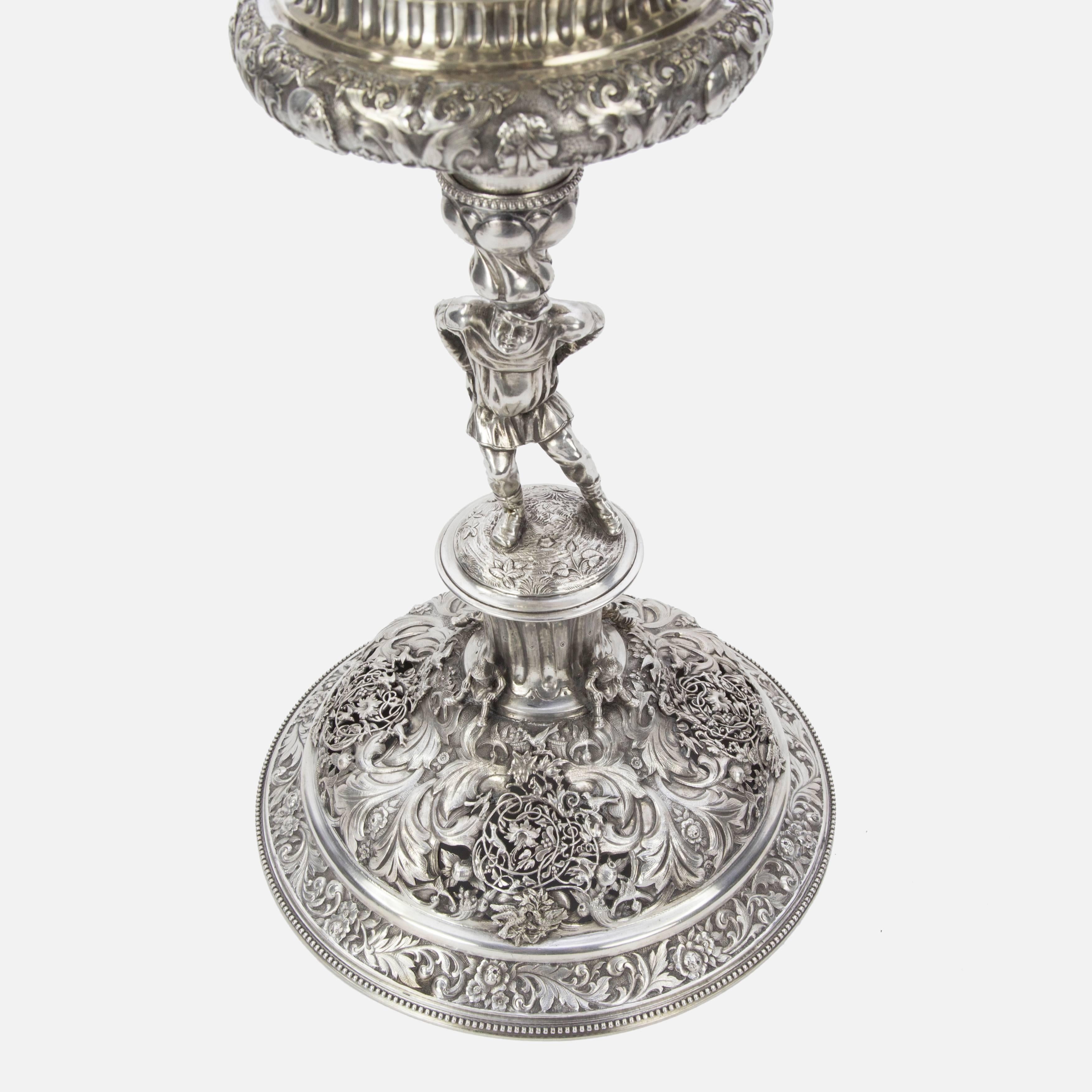 Sensational large silver Chalice with cover beautifully handcrafted entirely in silver (800 silver standard); decorated with motifs in relief, pierced, engraved and chased designs. It is inspired directly in similar pieces influenced by Medieval