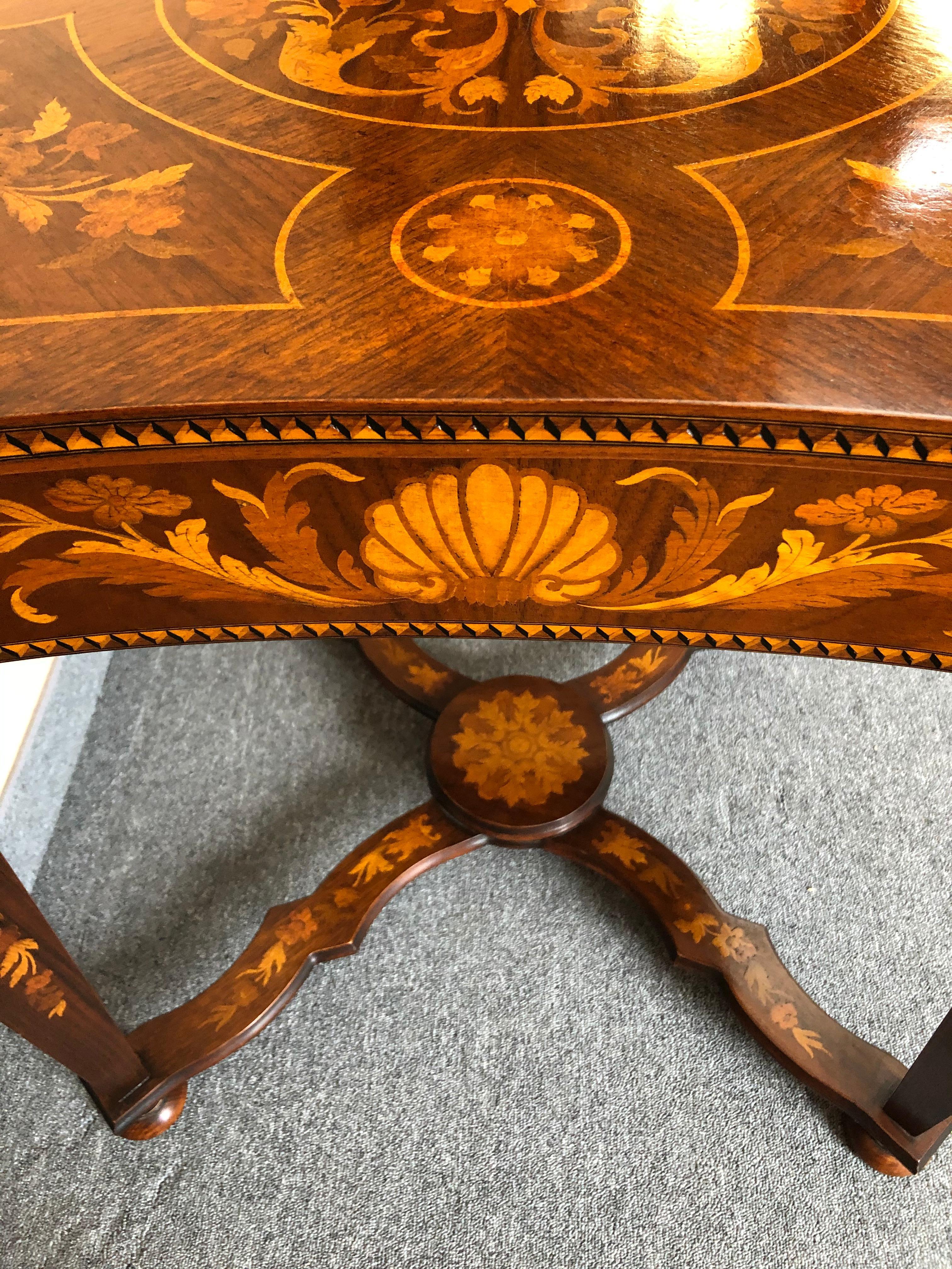 Magnificent Italian square center or game table having wonderful scalloped sides and meticulous marquetry inlay on every nook and cranny.