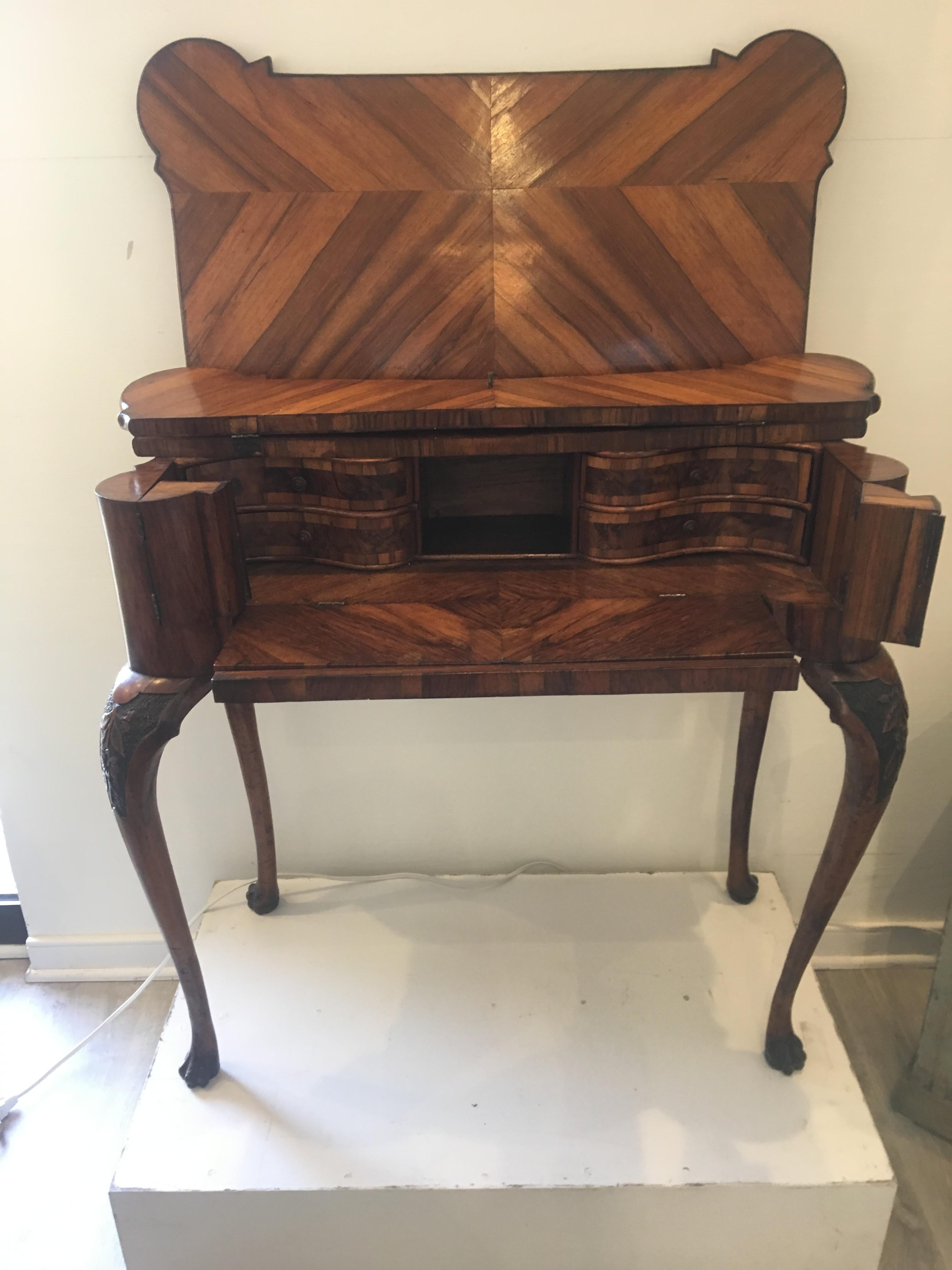 Magnificent 18th century Italian Modena carved and inlaid console table, card table, desk, circa 1750. Highly figured veneered and inlaid with other woods. Similar examples of this card table are published in the Graziano Manni, Mobili Antichi in