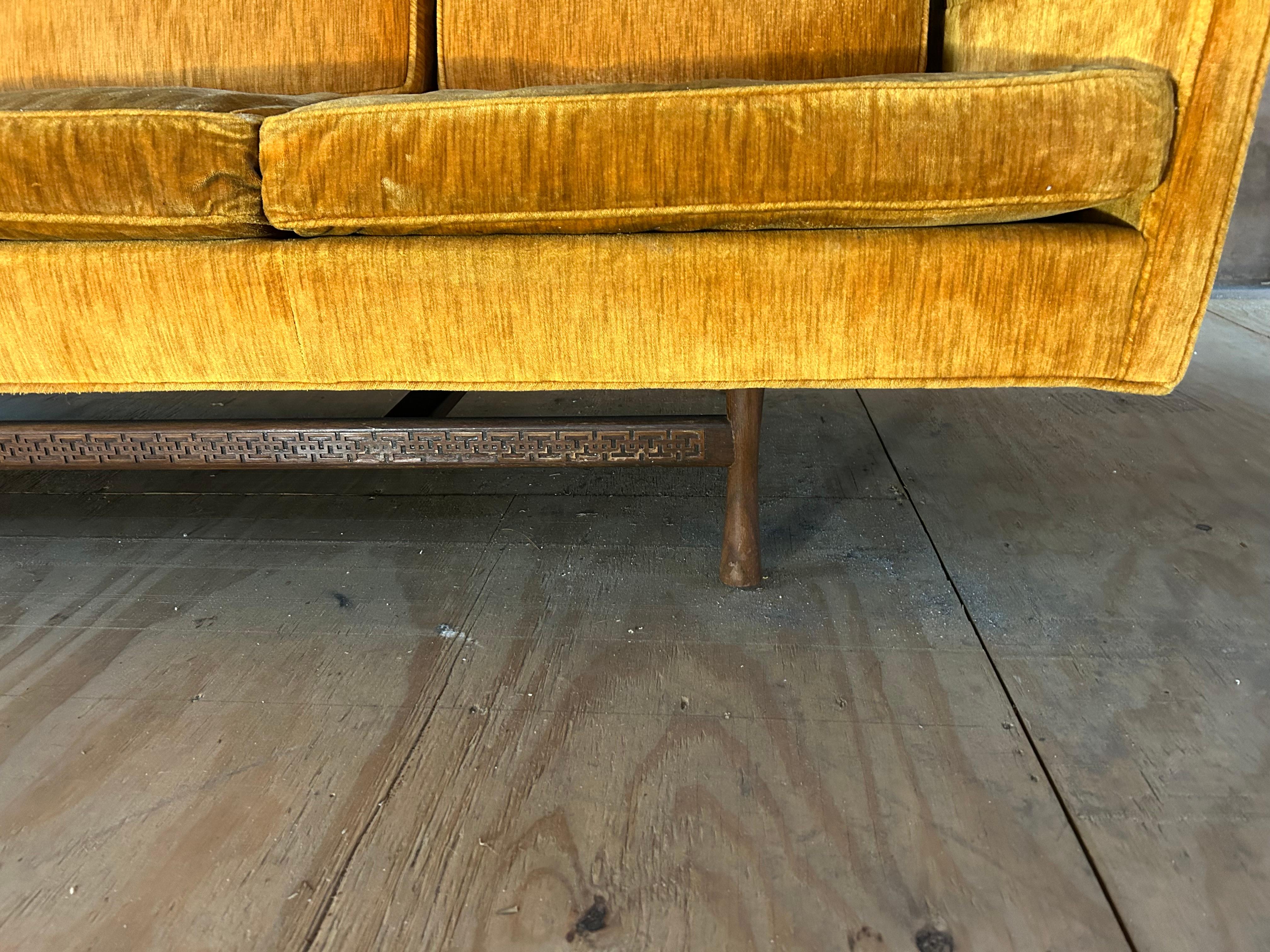 Stunning John Widdicomb long low carved walnut sofa, circa 60's.  This is the most unusual vintage sofa we have seen in quite sometime.  Look at the wonderful carved Greek-key details on the back rail and front rail of the base-fabulous to say the