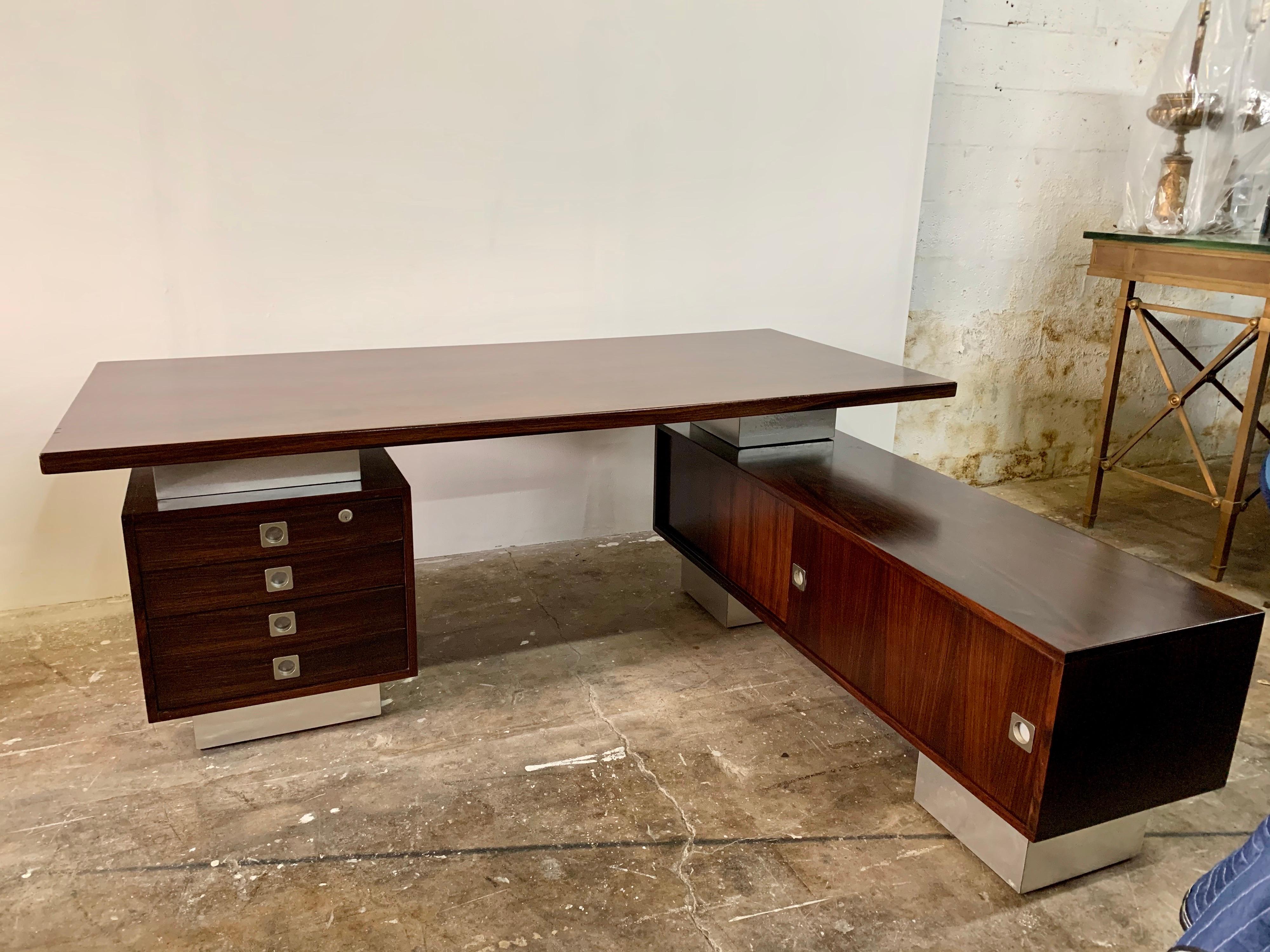 This outstanding executive desk is comprised of 3 parts; the top, the left side drawer’s cabinet and the right side long storage with sliding doors on both sides. It is all original fruitwood as acquired in Europe. This has not been restored because