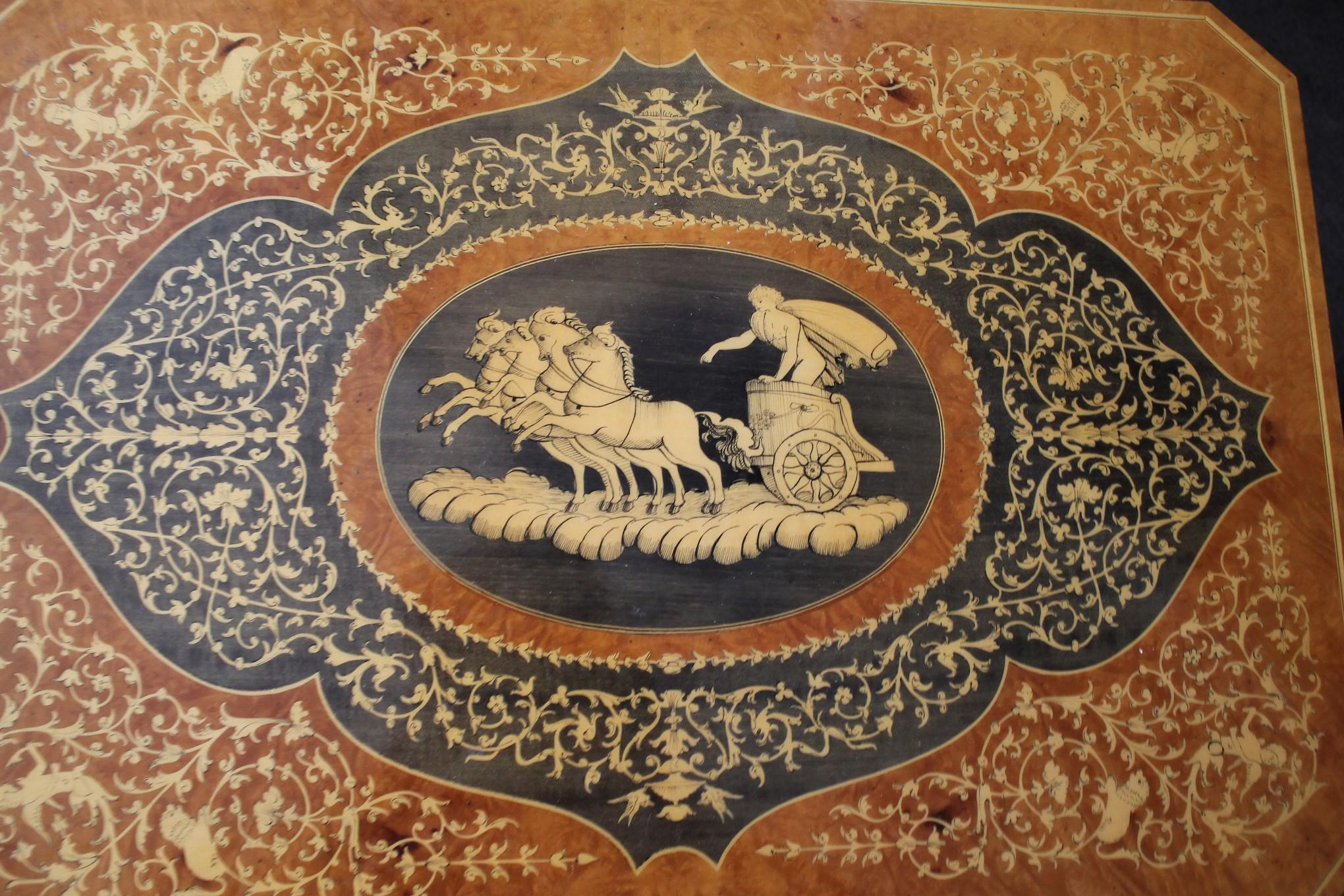 Neoclassical
Italian Hand Painted
Lacquered Wood
Gaming Table

Mythology Motif
Helios Chariot

This table is simply magnificent!  Helios is sailing across the heavens in his chariot and the work is incredible!  This table can be used for gaming and