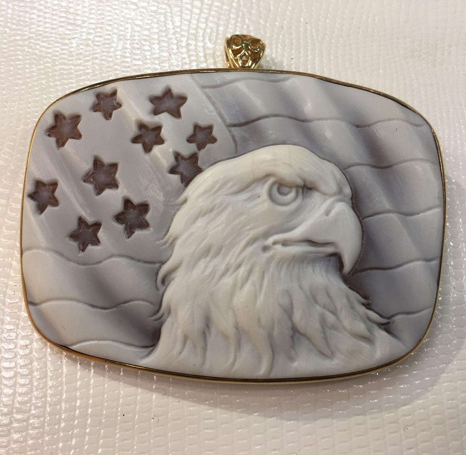 Majestic American Eagle on a backdrop of The Stars and Stripes; Finely hand crafted and signed Cameo set in gilded Sterling Silver mounting; So Striking and versatile, can be worn as a pendant or a brooch! Measuring approx. 2.5 inches x 1.25 inches.