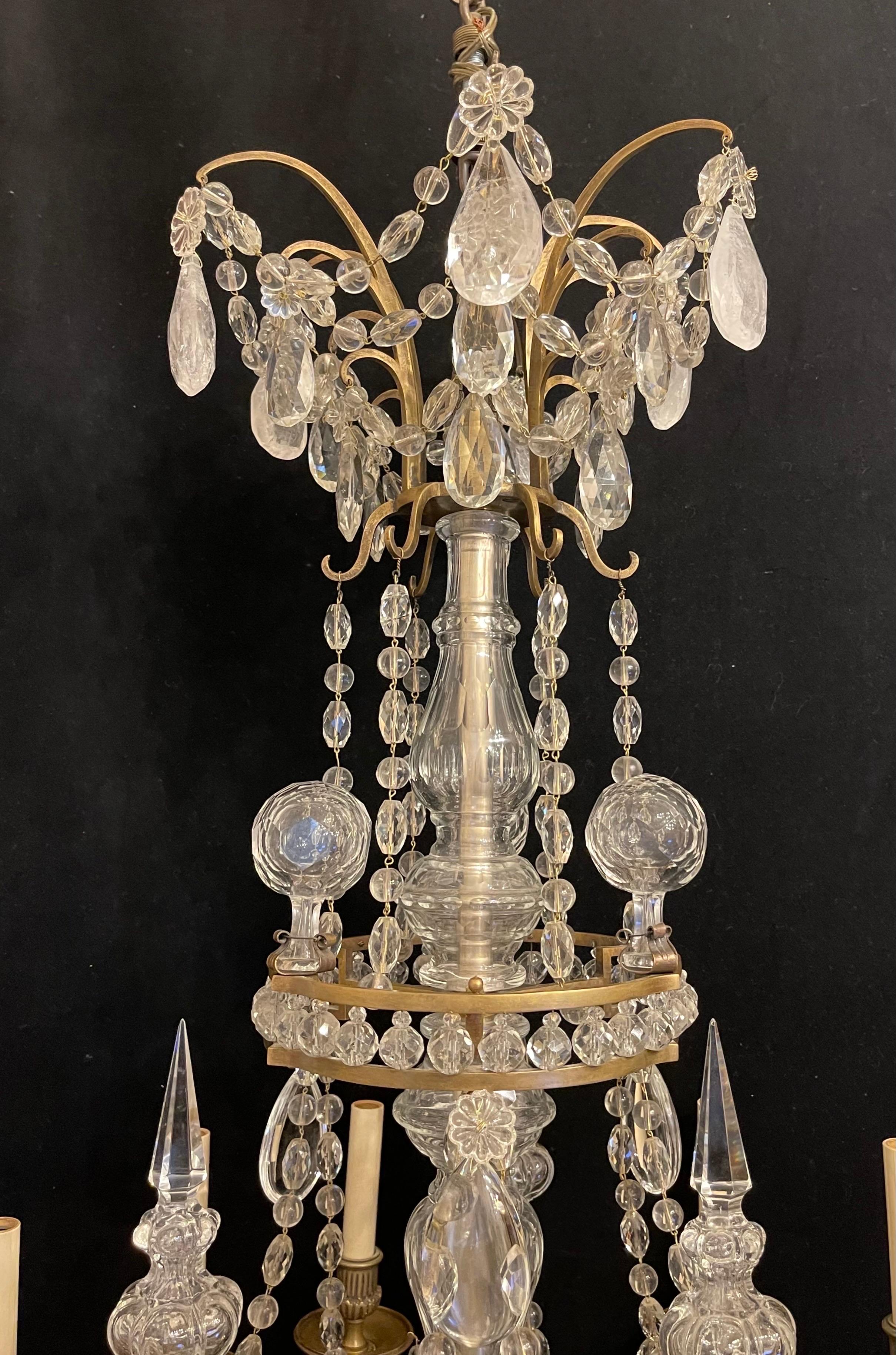 A Magnificent Large French Dore Bronze And Assorted Rock Crystal Louis XVI Style 9 Candelabra Light Chandelier In The Manner Of Maison Bagues.