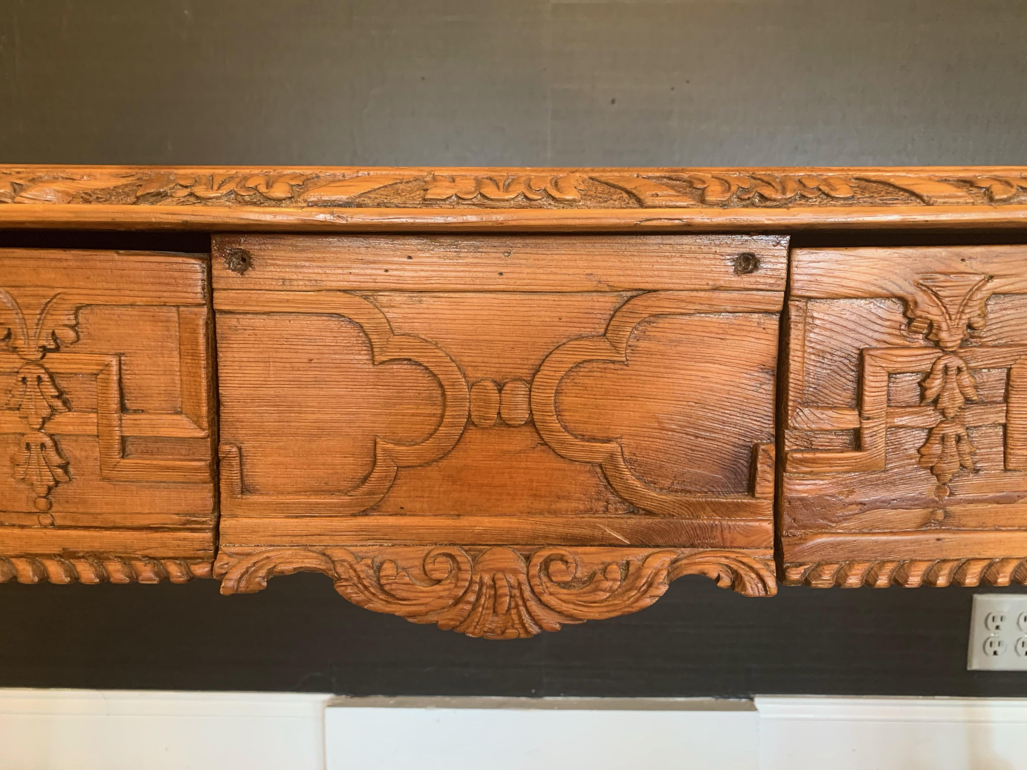 One of a kind rare beauty, early 19th century carved walnut and pine top Georgian serving or console table. Could also be used as a large desk, having two drawers and lovely cabriole legs terminating in ball and claw feet.
Measures: Apron height