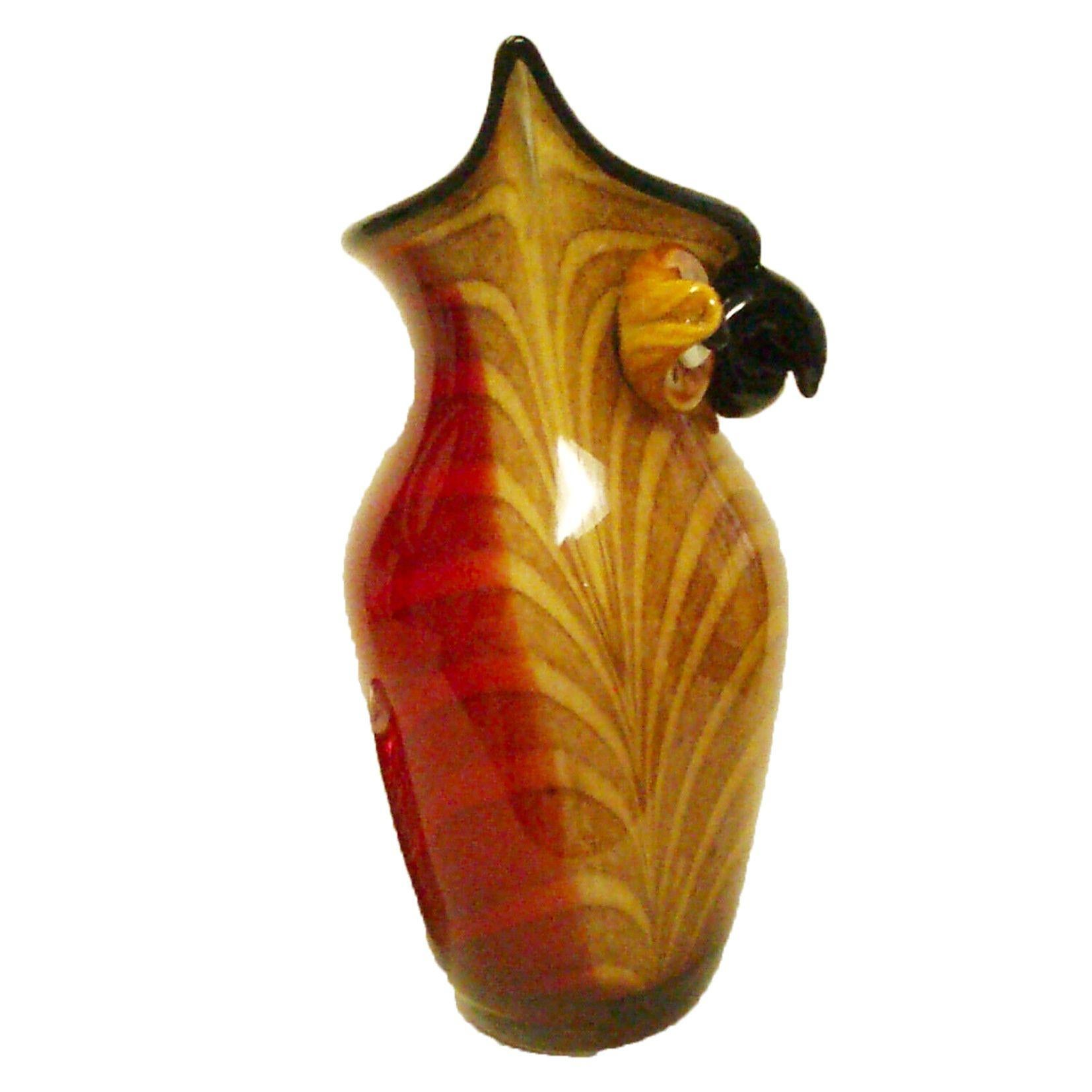 For the lovers of Murano, an alluring hoot owl art glass vase, a happy owl in iconic amber/brown front, white and black eyes and a black beak with a red design back. Approx. size: 15 inches high x 9 inches wide x 8 inches deep. 