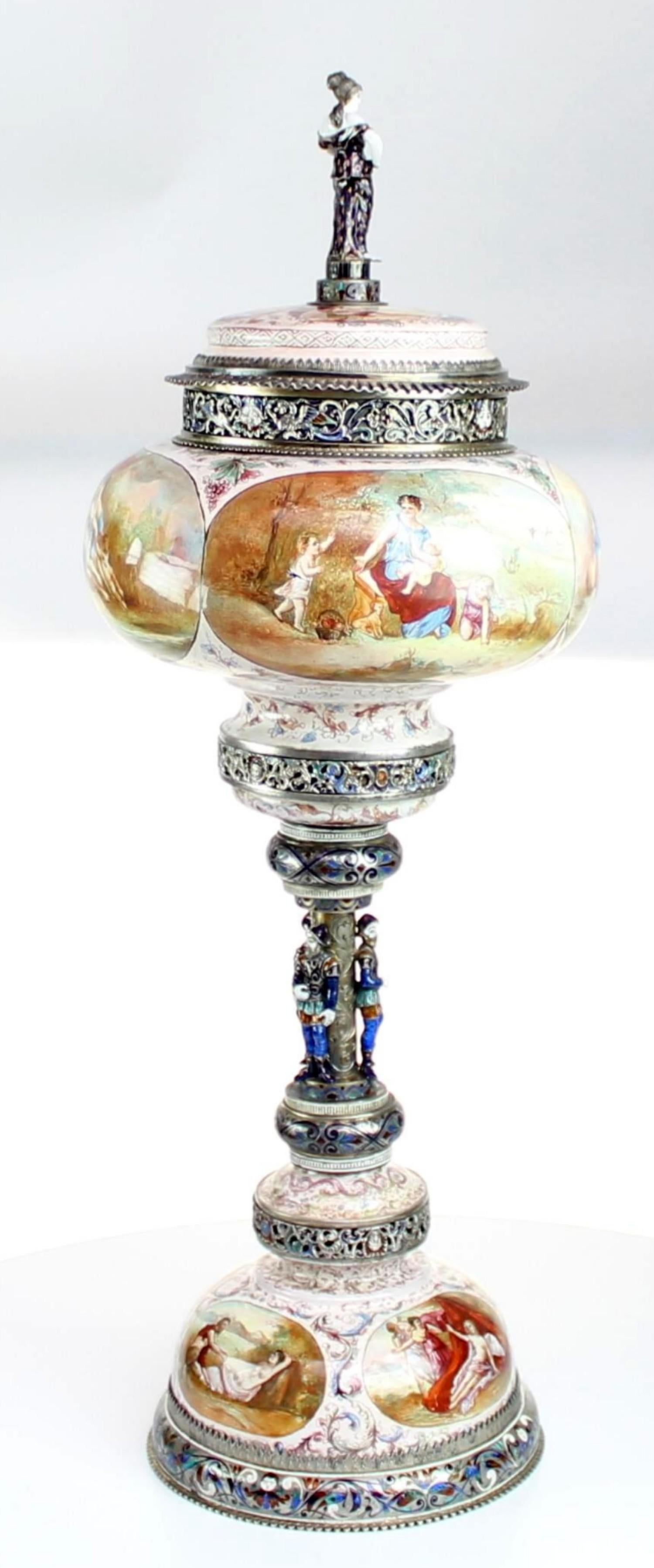 Magnificent large silver and Viennese enamel cup and cover by Hermann Bohm, Vienna, circa 1880

The cover with an enameled finial of a classical maiden on a domed base with two reserves painted with scenes of Venus at her toilet with sliver pie