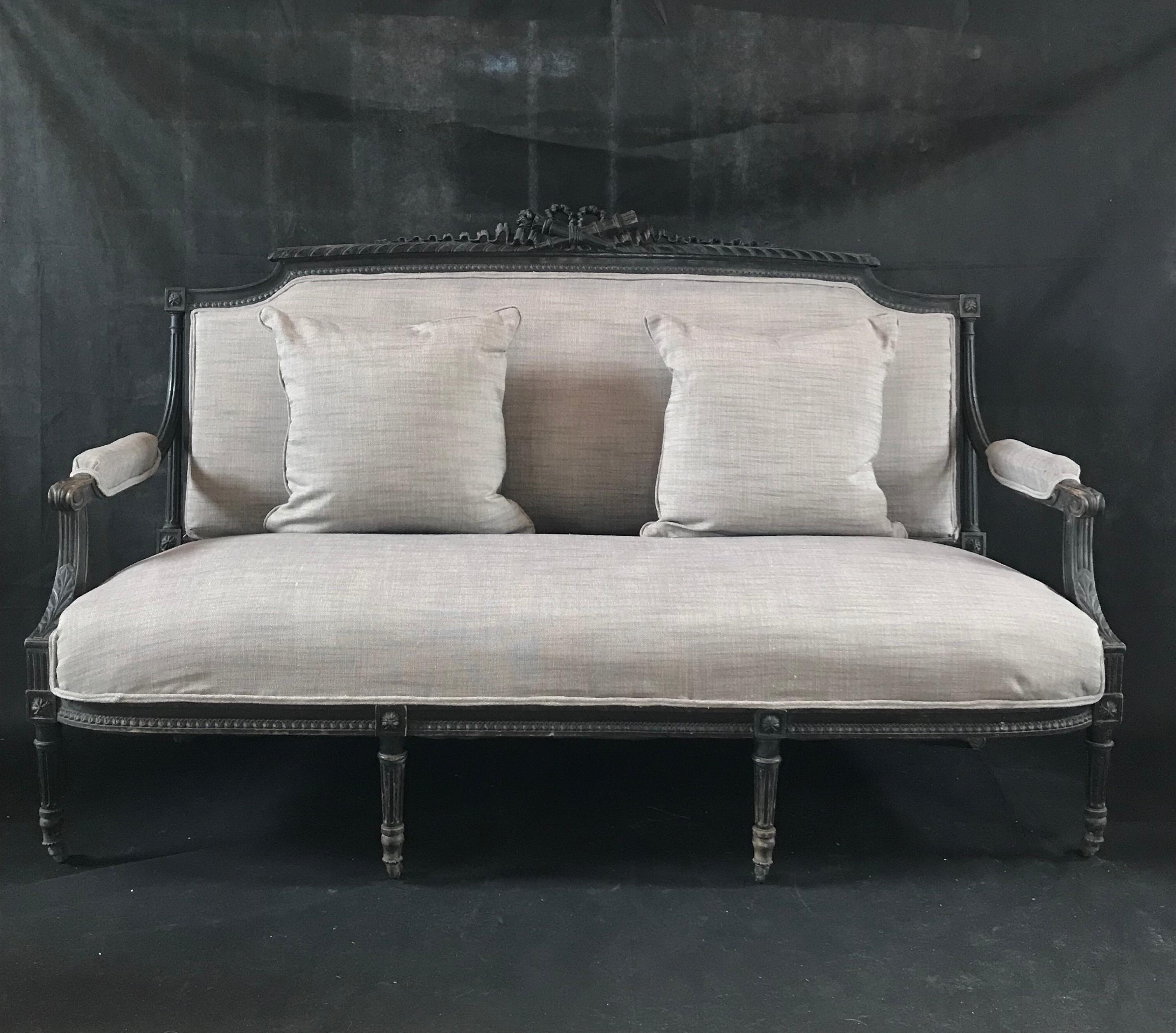 A gorgeous 19th century sofa bought in Avignon France having stunning carvings, original wood casters, and all new cotton/linen upholstery including two pillows.
Measures: Seat height 21.