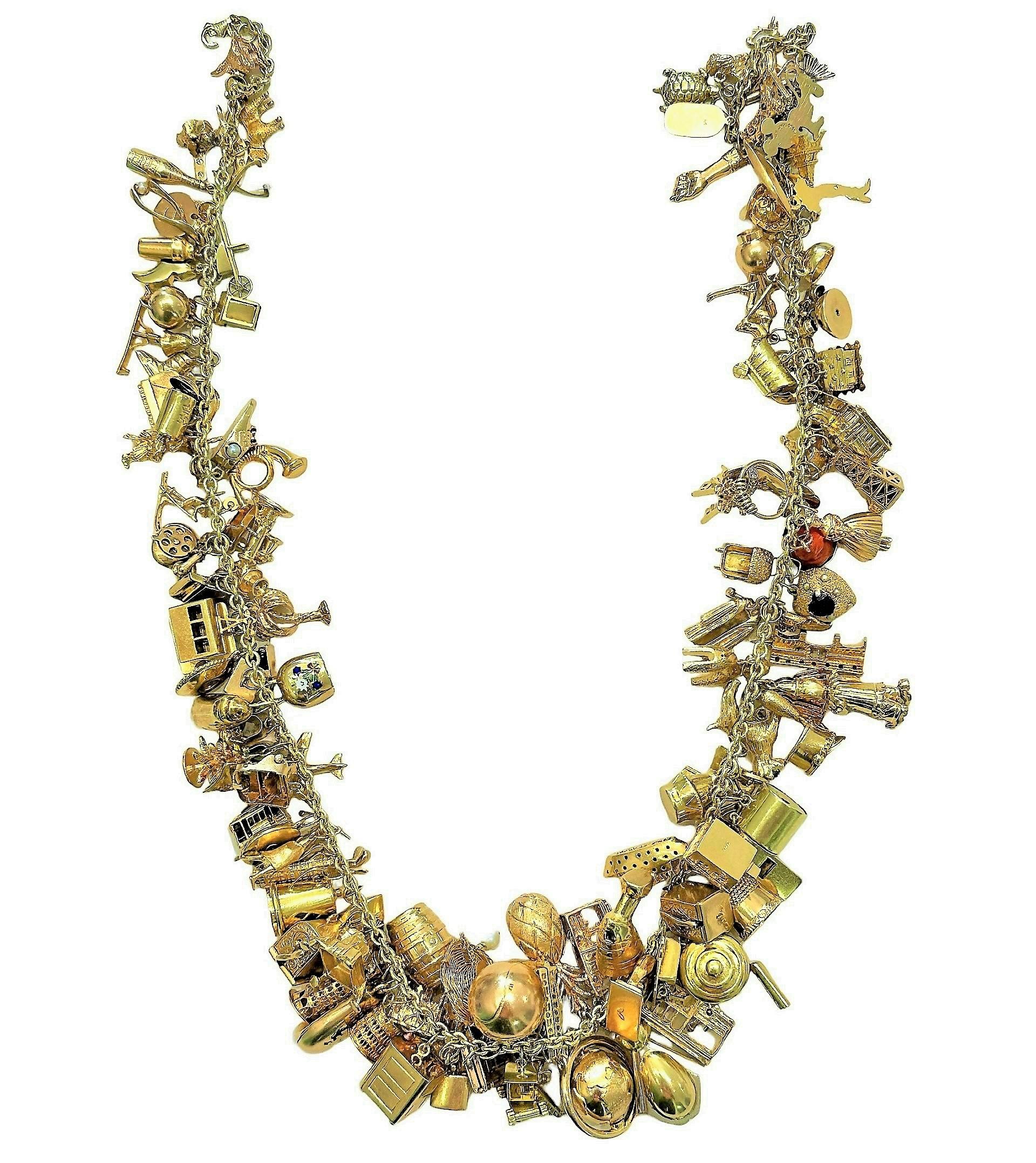 Magnificent Mid-20th Century 14k Yellow Gold Charm Necklace In Good Condition For Sale In Palm Beach, FL