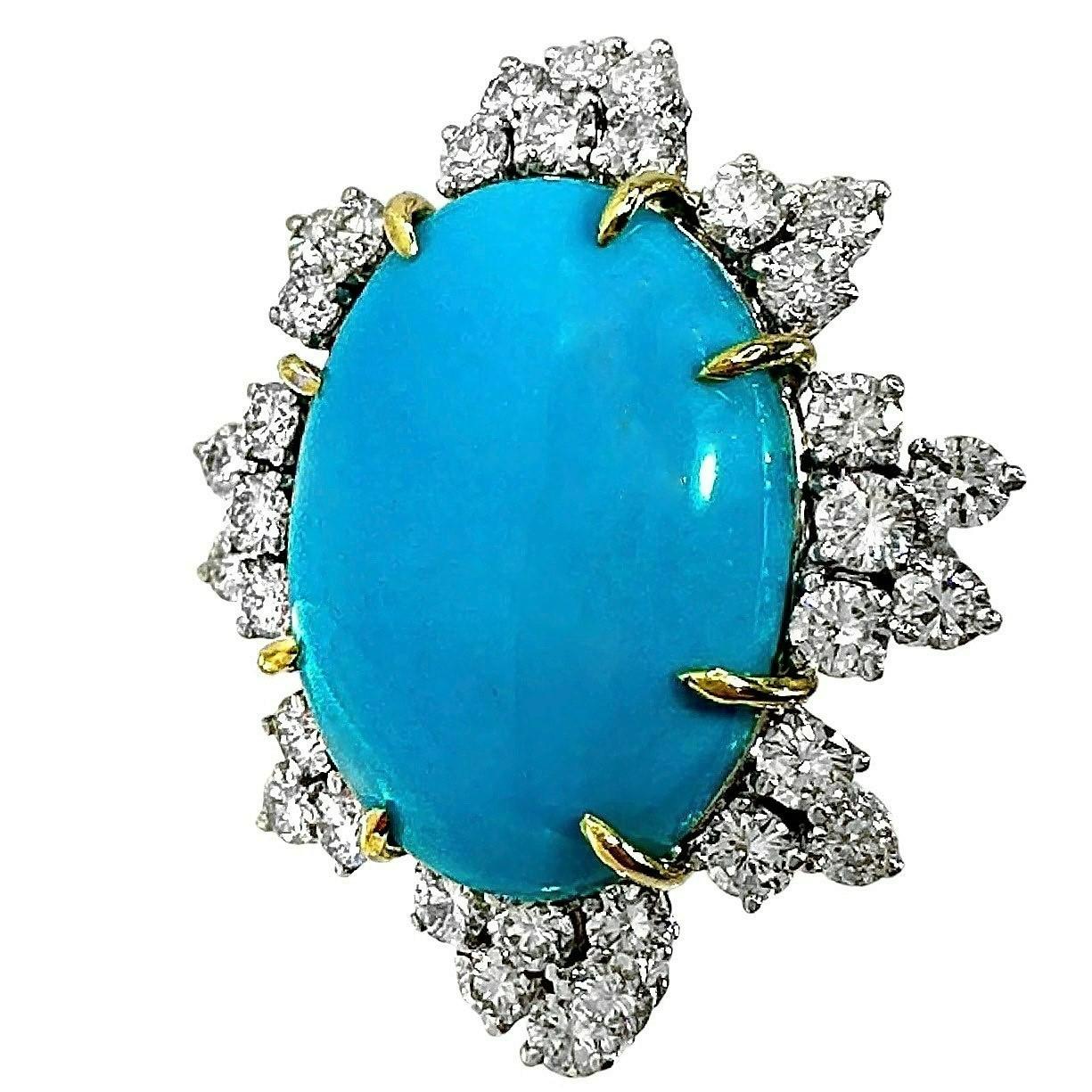 This extremely aesthetic, vintage cocktail ring makes a strong statement. With a length of over 1.5 inches and a width of 1.25 inches, it is impossible to miss.  The vivid blue natural turquoise cabochon measures 1 inch in length by 3/4 inch in