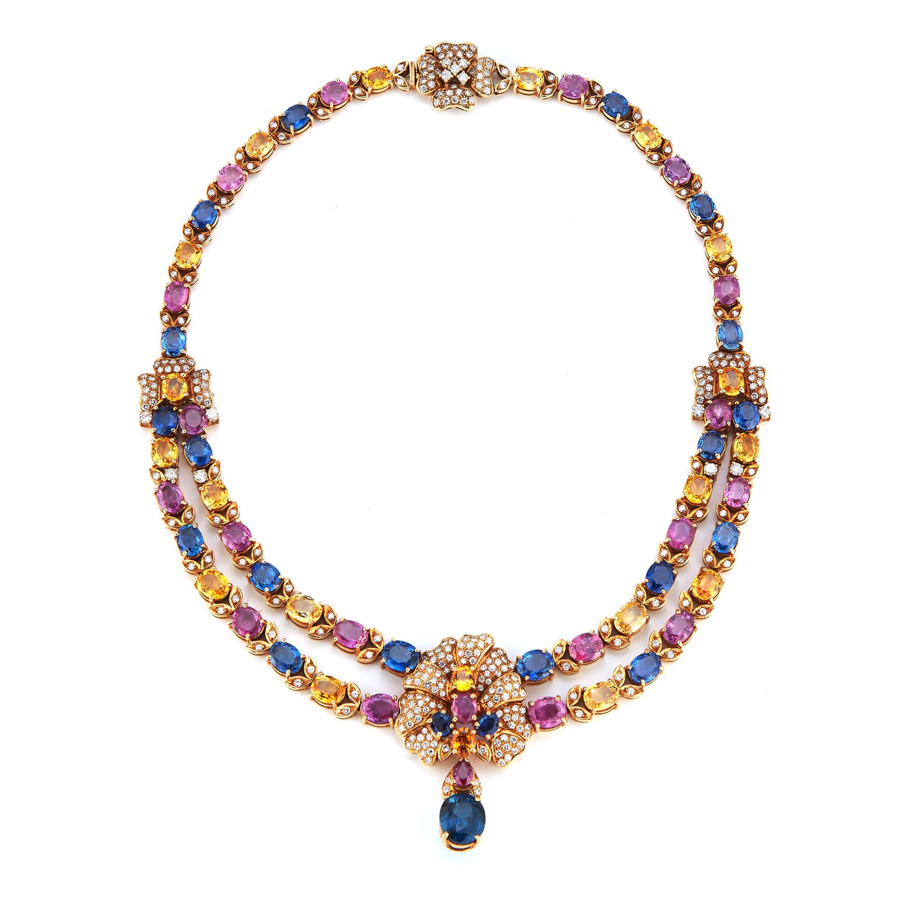 Magnificent Multi Color Sapphire & Gold Necklace 
18K Yellow gold foliate design neck with 310 Brilliant cut diamonds approximately 6.37 ct and 20 pink sapphires approximately 29.7 ct and 20 oval blue sapphires approximately 25.65 ct and 30 oval