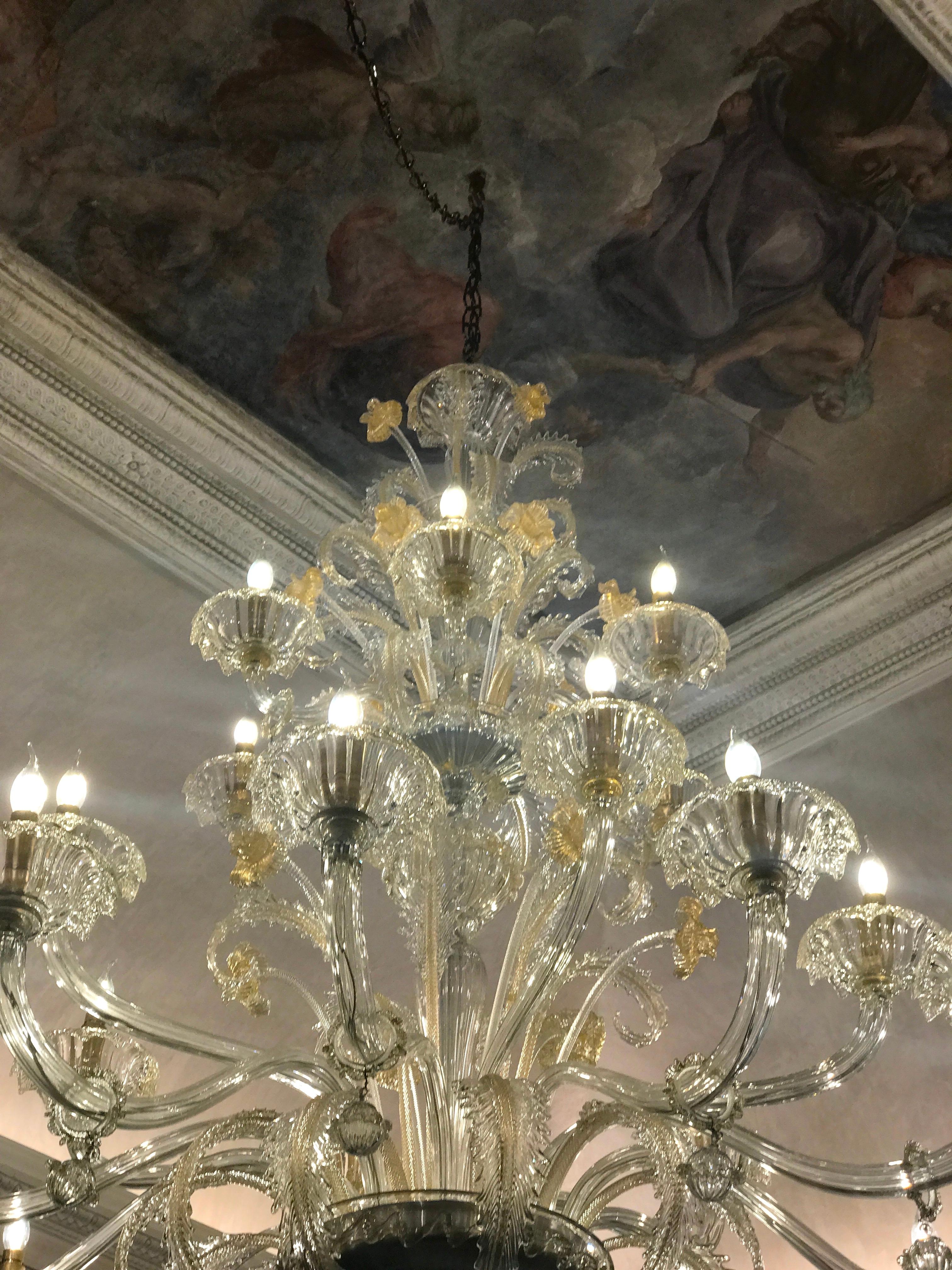 Spectacular Murano chandelier. The arms 24 are arranged on three floors. The glasses are embellished with gold inclusions in perfect condition.
 24 E 27 light bulbs or we can wire with E 14 candles. 
Provenance from a Roman Historic Palace.
