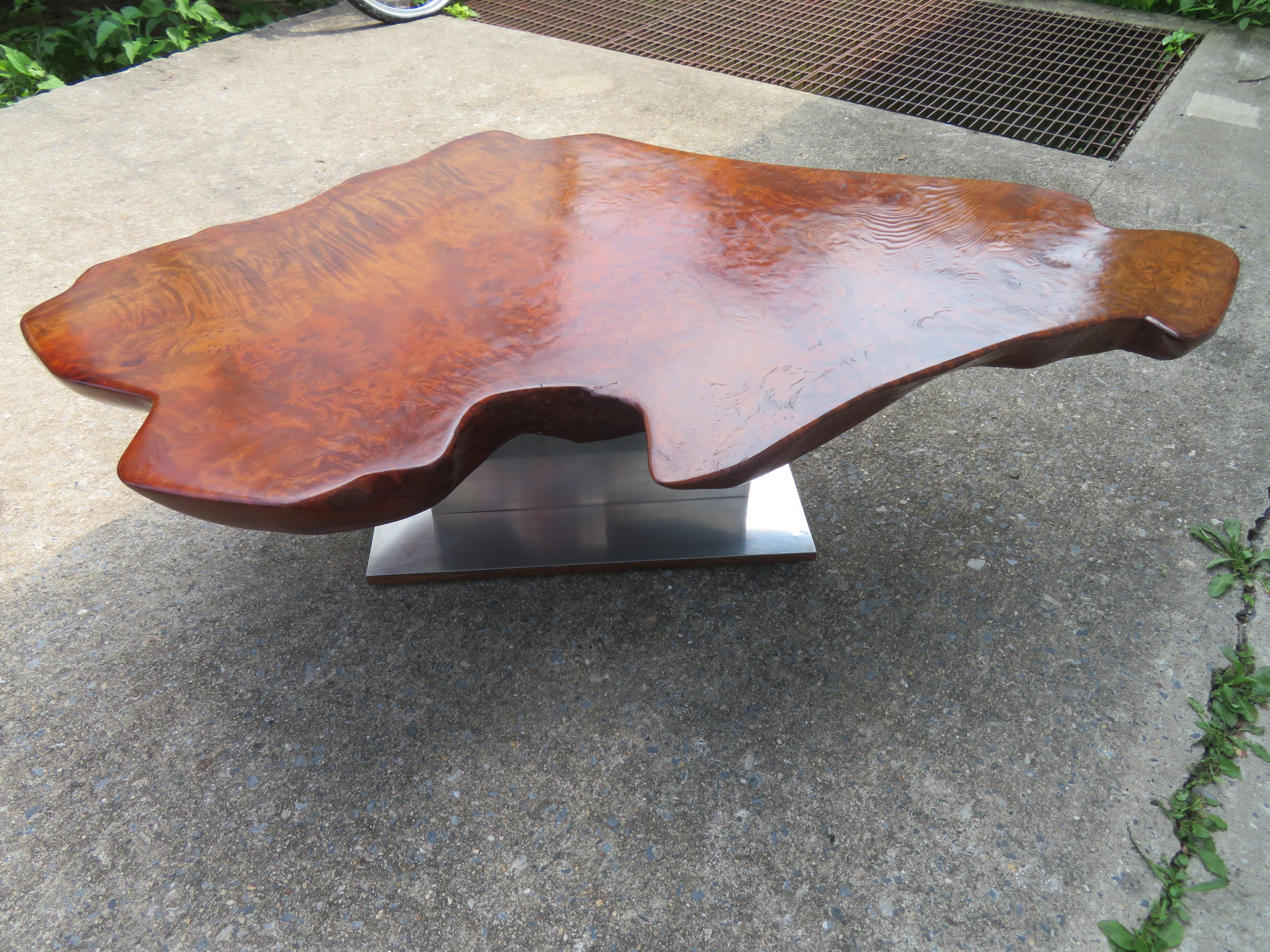 Magnificent Nakashima style free edge bird's-eye maple slab coffee table with chunky steel base. This table was designed and crafted by the very talented contemporary artist Gary Zayon about 15 years ago.
He is a modern furniture designer and