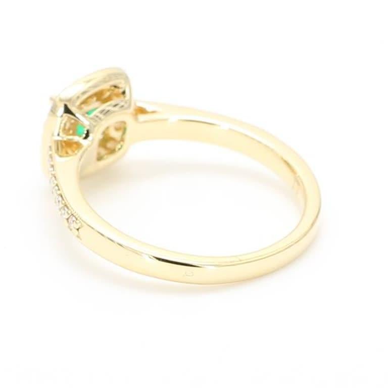 Contemporary Natural Emerald Cut Emerald and White Diamond .66 Carat TW Yellow Gold Ring For Sale