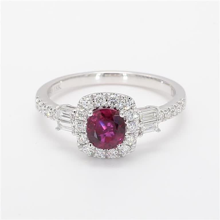 RareGemWorld's classic ruby ring. Mounted in a beautiful 18K White Gold setting with a natural cushion cut red ruby. The ruby is surrounded by natural baguette cut white diamonds and natural round white diamond melee. This ring is guaranteed to