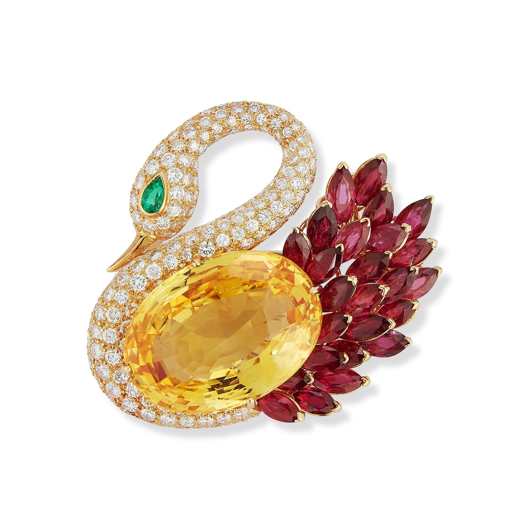 Magnificent Natural Yellow Sapphire Swan Brooch by Bvlgari 

This captivating design includes a natural 62.69 Carat Yellow Sapphire certified by AGL laboratories 
Further set with Burmese Rubies (16.75 ct0, diamonds (7 carats) and an emerald eye