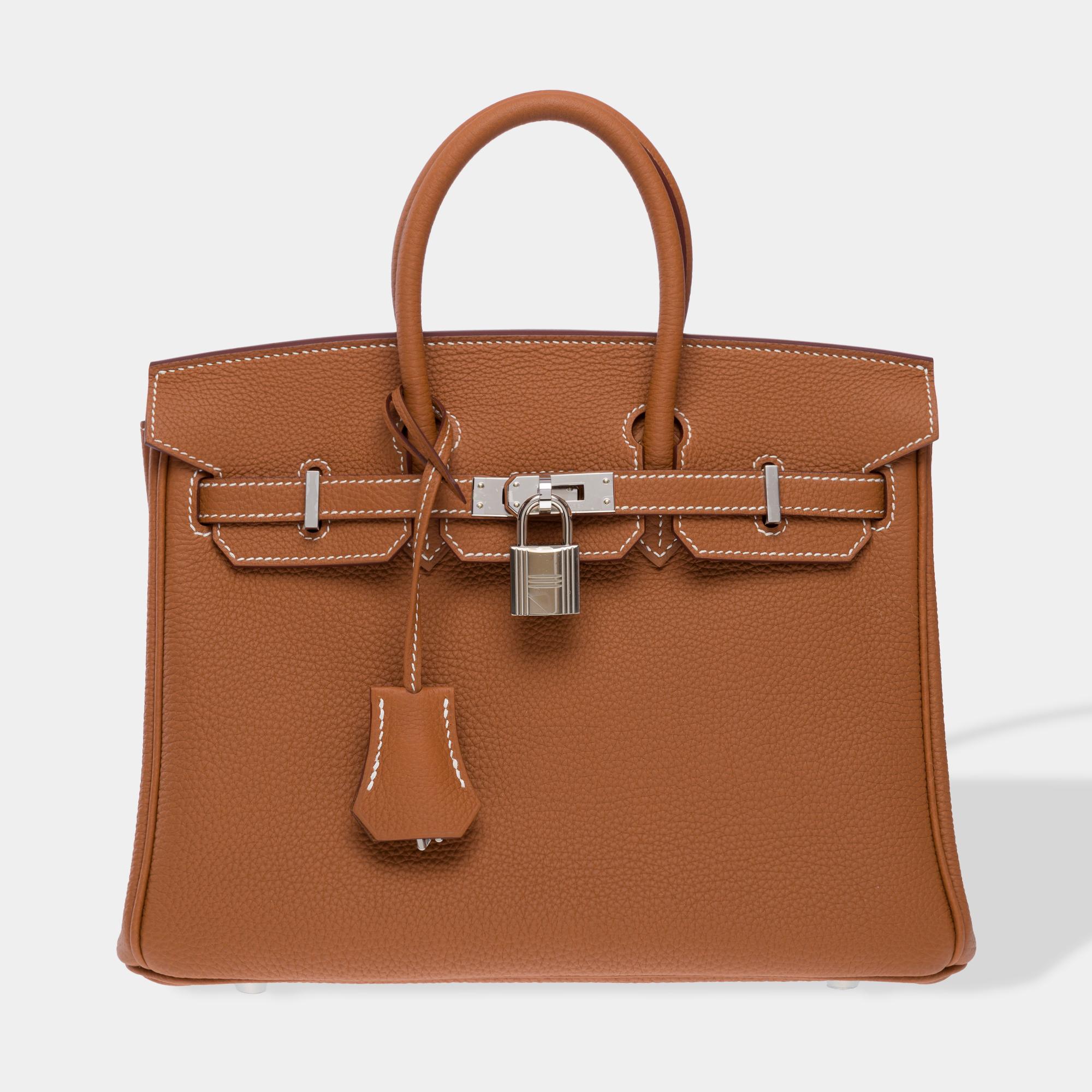 Exquisite​ ​Birkin​ ​25​ ​handbag​ ​in​ ​Gold​ ​Togo​ ​leather​ ​,​ ​silver​ ​metal​ ​trim,​ ​double​ ​leather​ ​gold​ ​handles​ ​allowing​ ​for​ ​hand​ ​carry

Flap​ ​closure
Beige​ ​leather​ ​interior​ ​lining,​ ​one​ ​zip​ ​pocket,​ ​one​ ​flat​