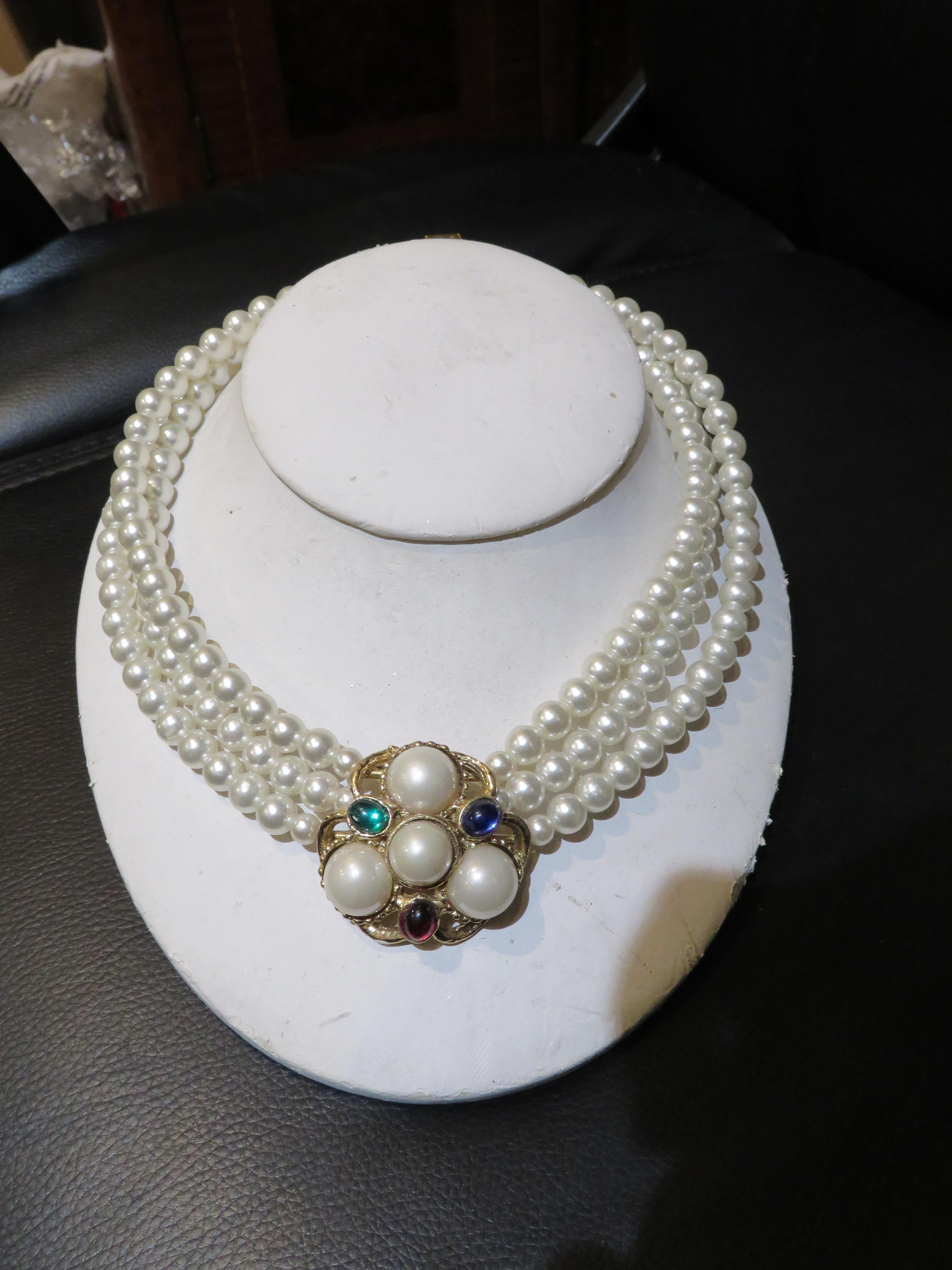 The Following Item we are offering is a Rare Important Radiant 18KT Overlaid Gold Tripe Strand Costume Pearl Necklace This Gorgeous Piece is a Vintage Piece and has 3 Magnificent Strands of Rounded Costume South Sea looking Pearls. Center is