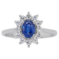 Magnificent Oval Brilliant Sapphire Ring with Side Diamonds in 18K White Gold 