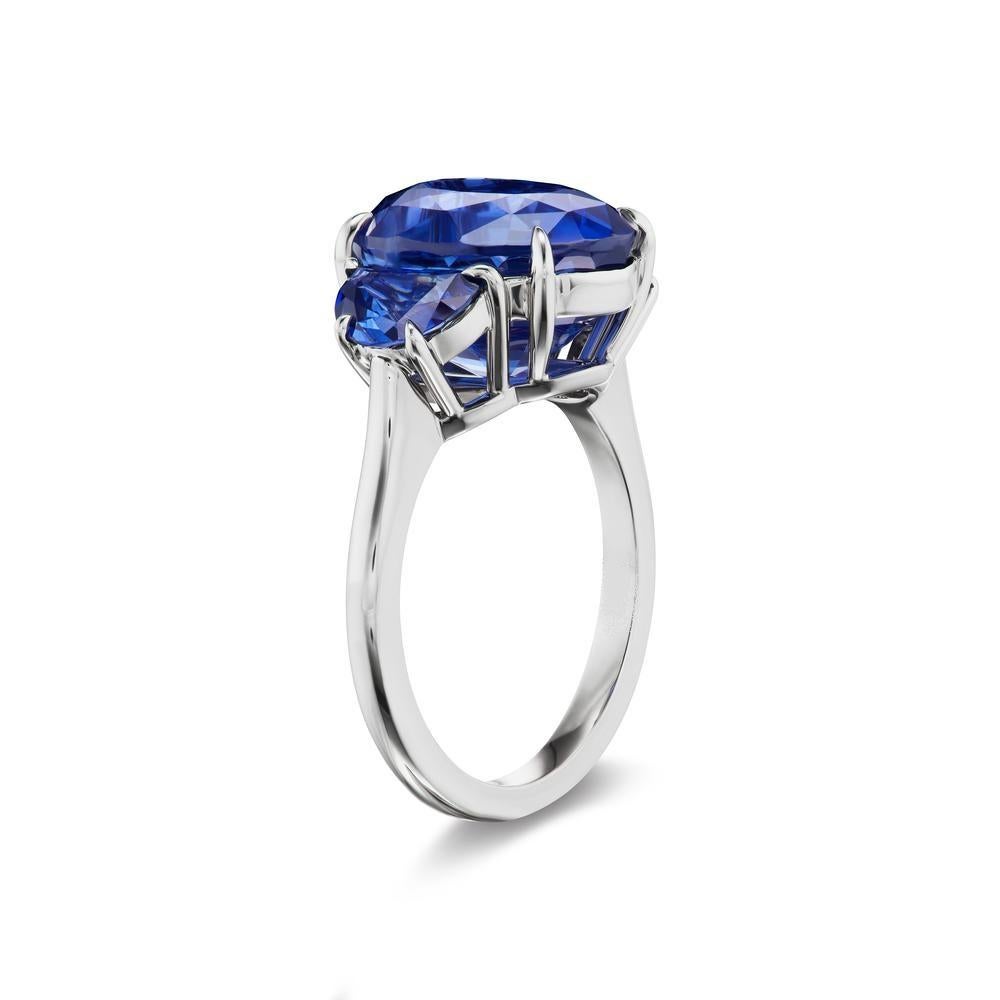 MAGNIFICENT OVAL
SAPPHIRE RING
Set in a beautiful 4 claw prong setting, sits a vibrant deep blue 9 ct. Oval
shaped Sapphire set in 18K White Gold. Surrounding the beauty of this
beautiful blue stone are 2 glimmering half moon shaped sapphires