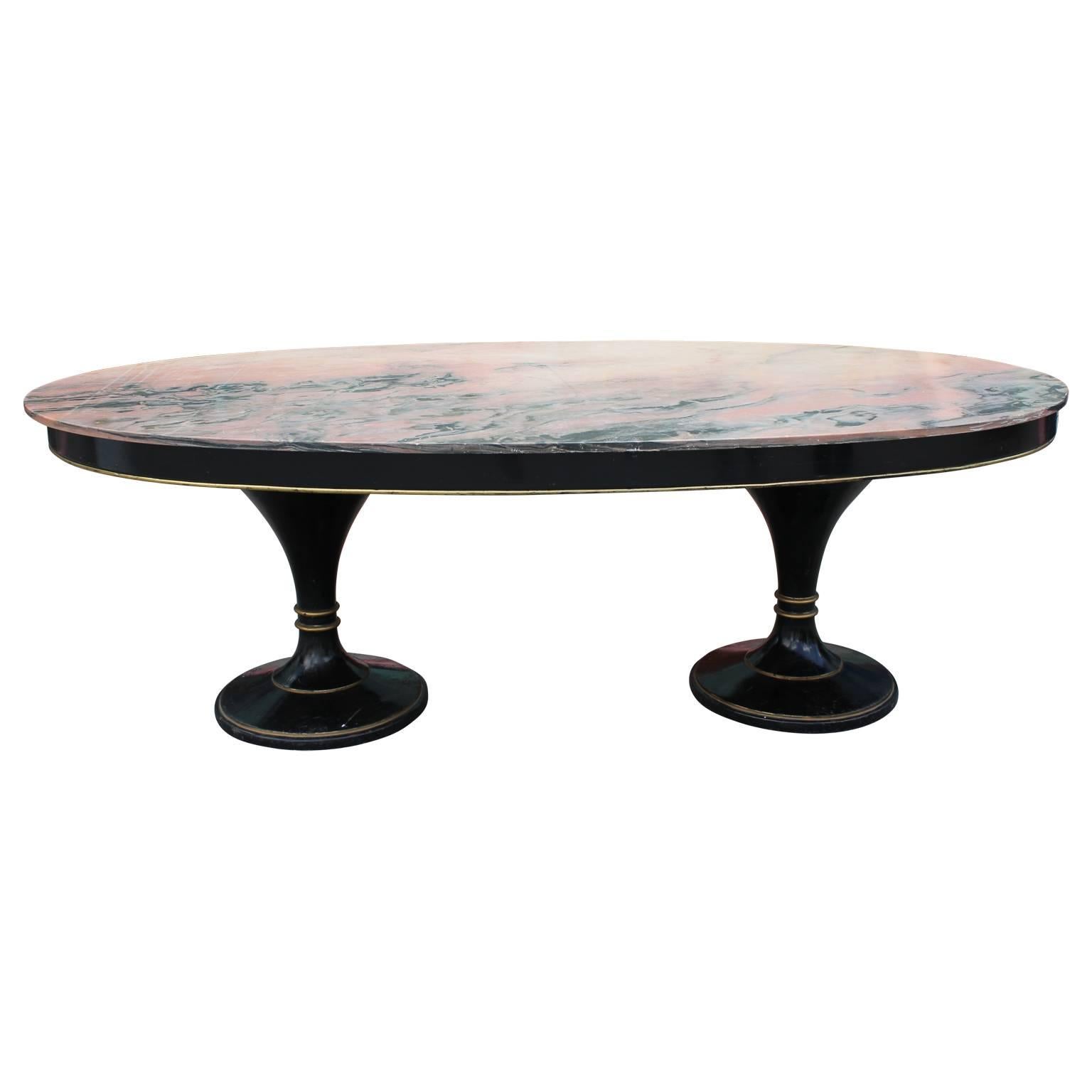 Oval top dining table with pink marble attributed to Maison Jansen, made in Argentina.