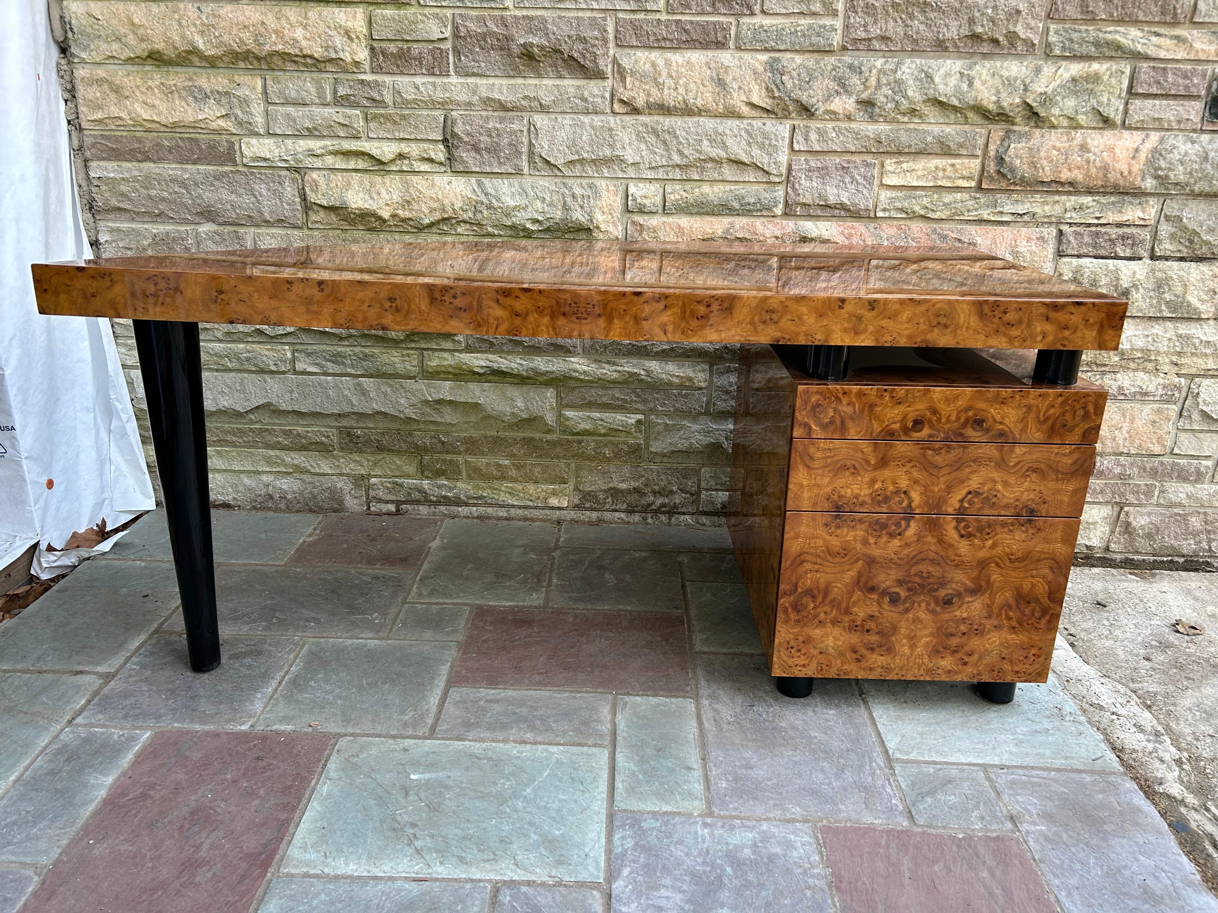 Magnificent Pace Collection burl wood desk designed by Leon Rosen.  This desk is in amazing vintage condition with a high gloss finish over the stunning burl wood.  This desk is a stunner from all angles and would be fabulous placed in the middle of