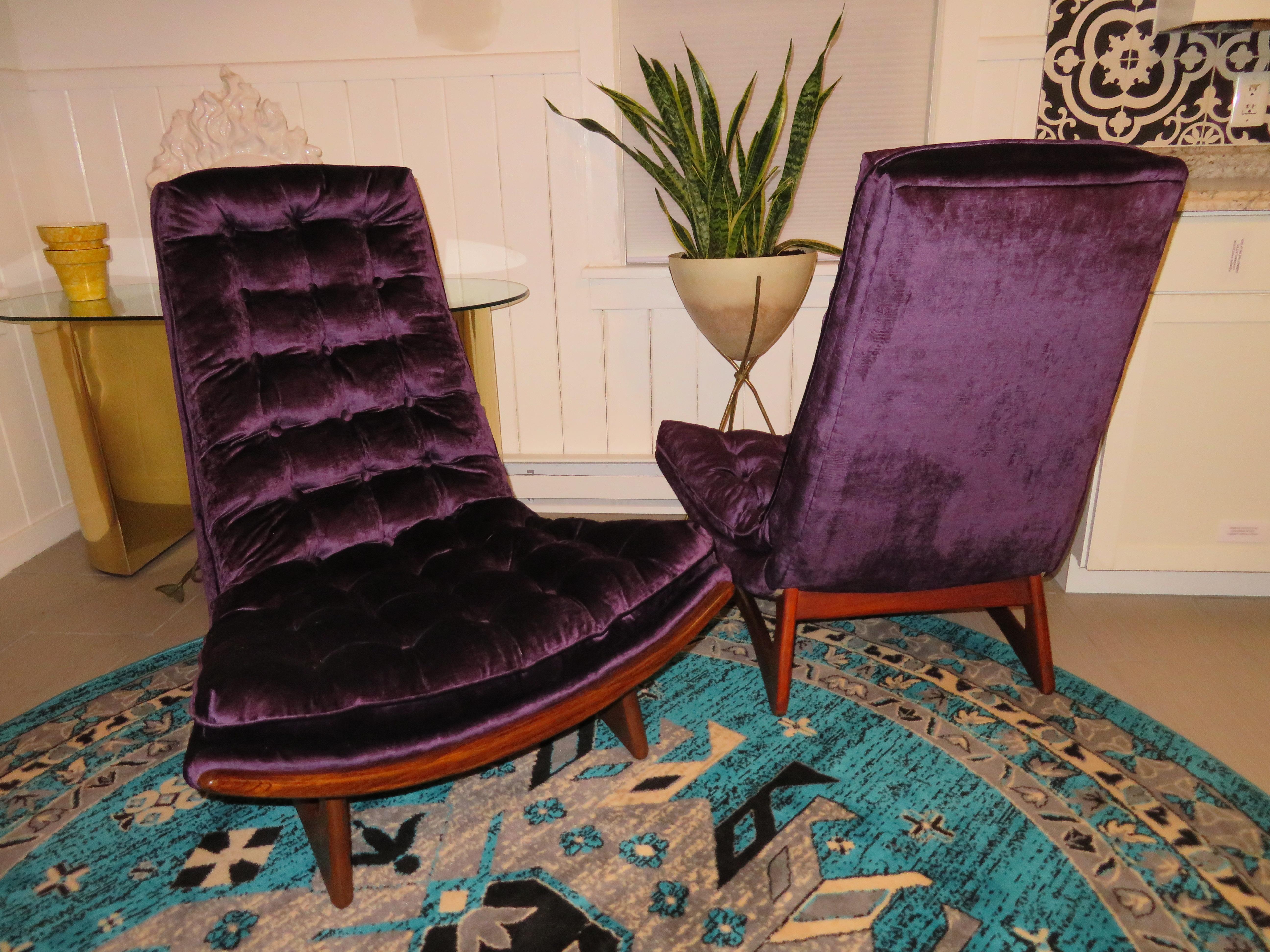 Magnificent pair of restored Adrian Pearsall tufted sculptural walnut scoop chairs. These rare chairs have been reupholstered in the most glorious jewelled tone purple velvet and look amazing. The sculptural walnut bases have been re-glued and also