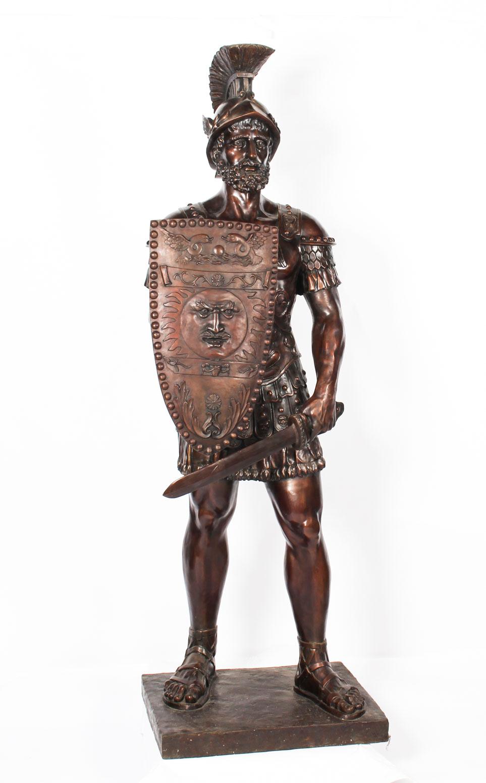 This is a fine pair of huge larger than life size bronze Roman soldiers dating from the last quarter of the 20th century.

One warrior is holding a spear, the other wields a sword and they appear to be ready for battle.

The armour is beautifully